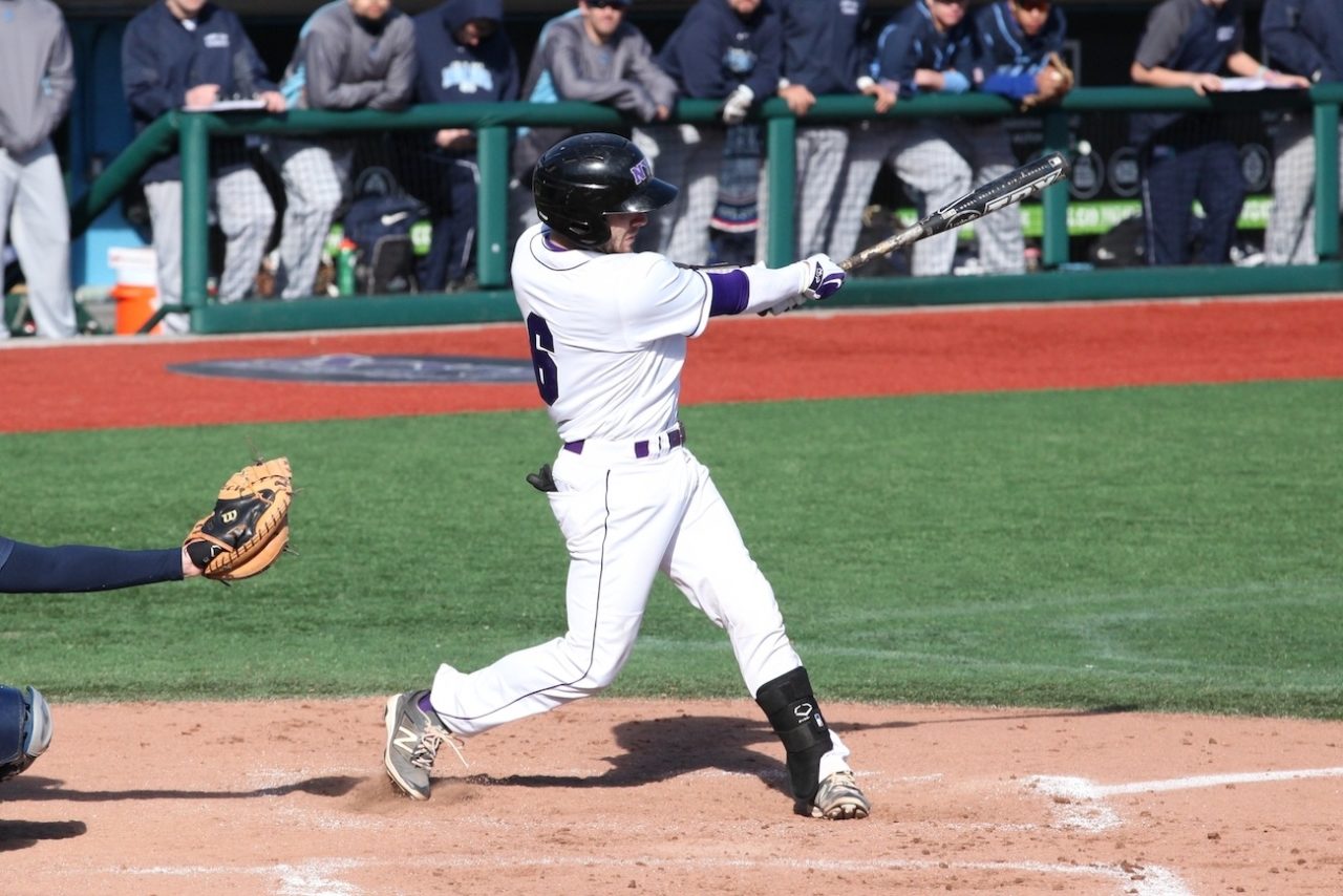 C.J. Picerni swings a baseball bat at homeplate.