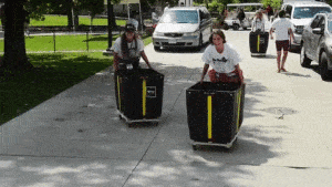 Students using bins to transfer items to residence halls on move-in day