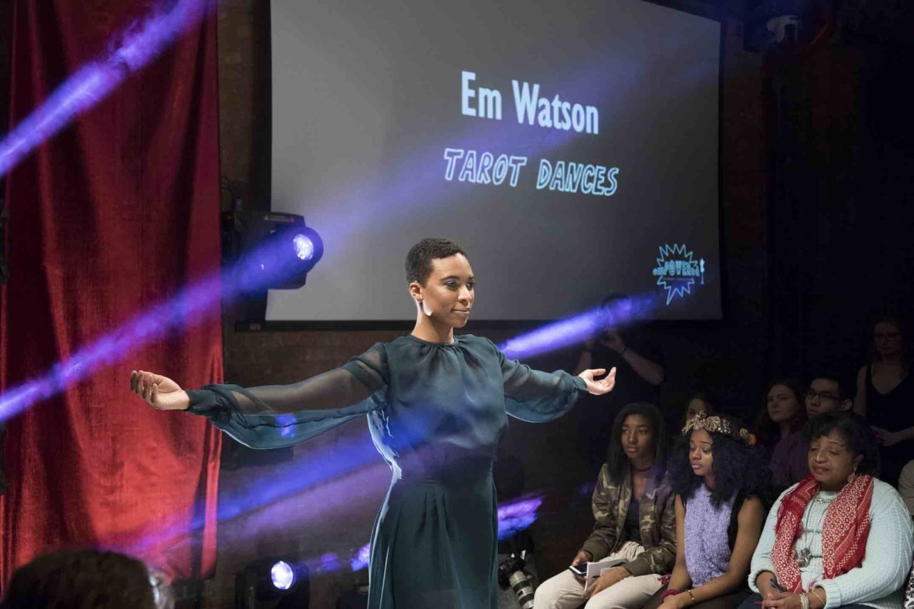 model in dress with arms outstretched