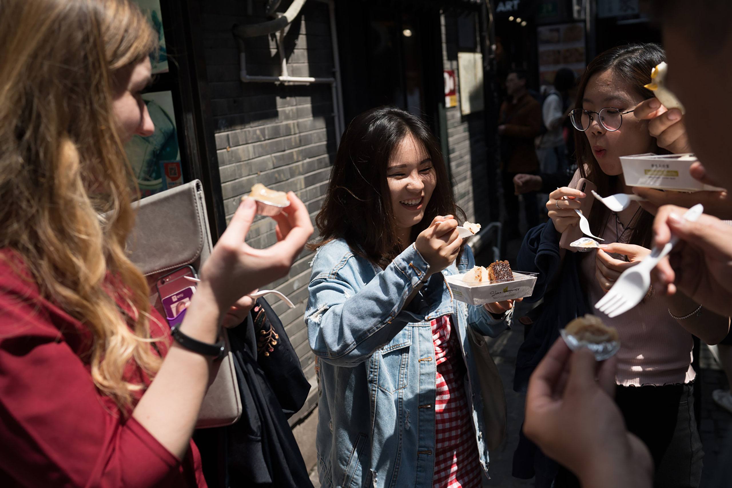 Students eating street food in Shanghai