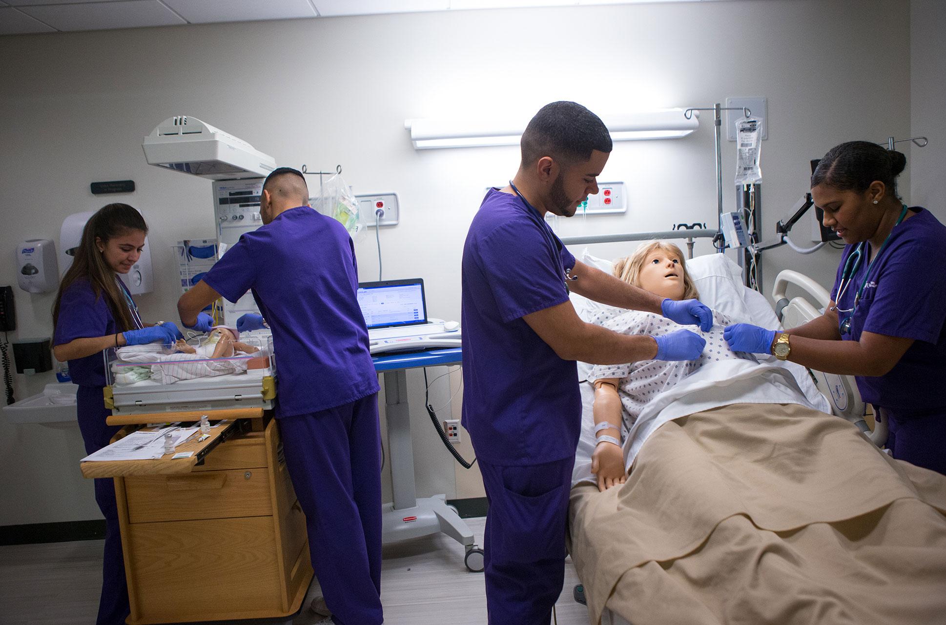 Nursing students work in NYU's simulation lab