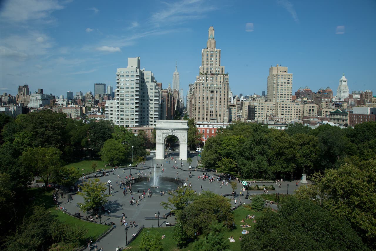 A bird's eye view of the fountain and the arch in Washington Square Park.