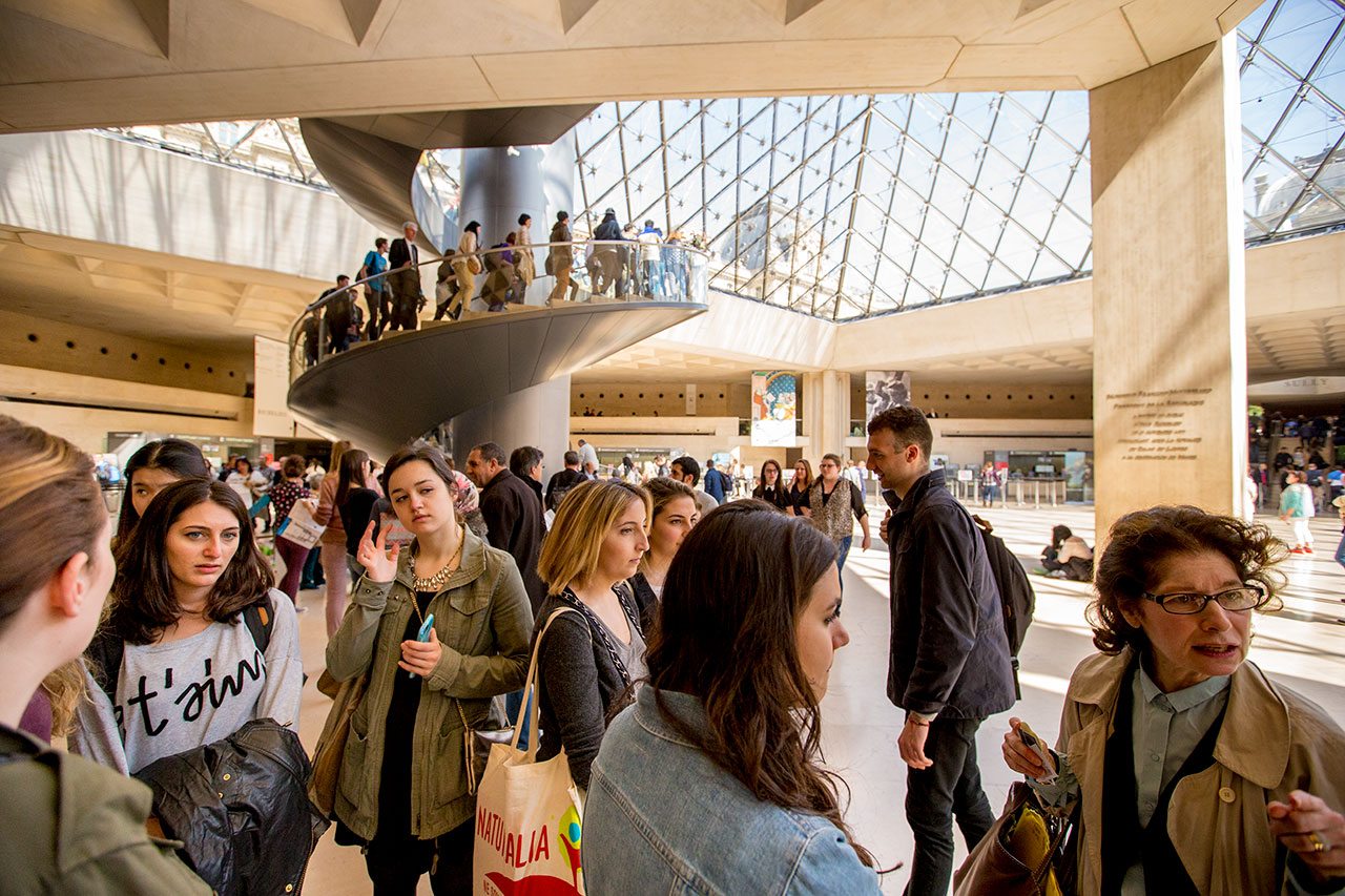 Students studying art abroad at NYU Paris have a class at the Louvre