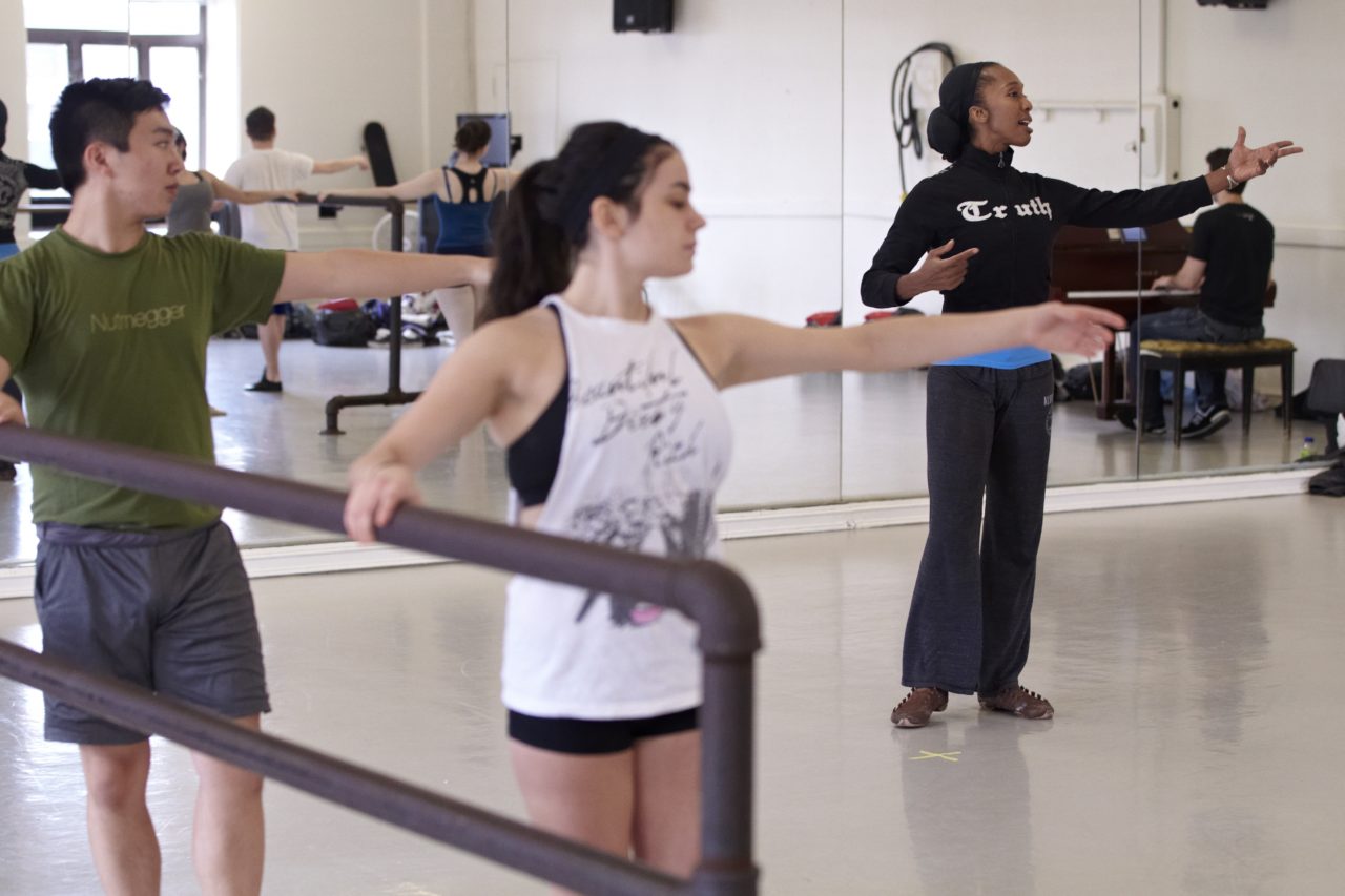 Students and teacher in a ballet class.
