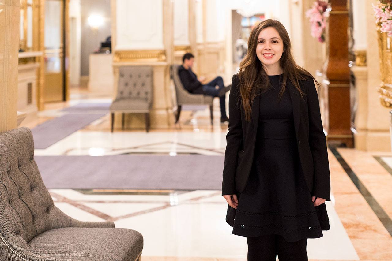 Student Sophy Martorell standing in a hotel lobby.