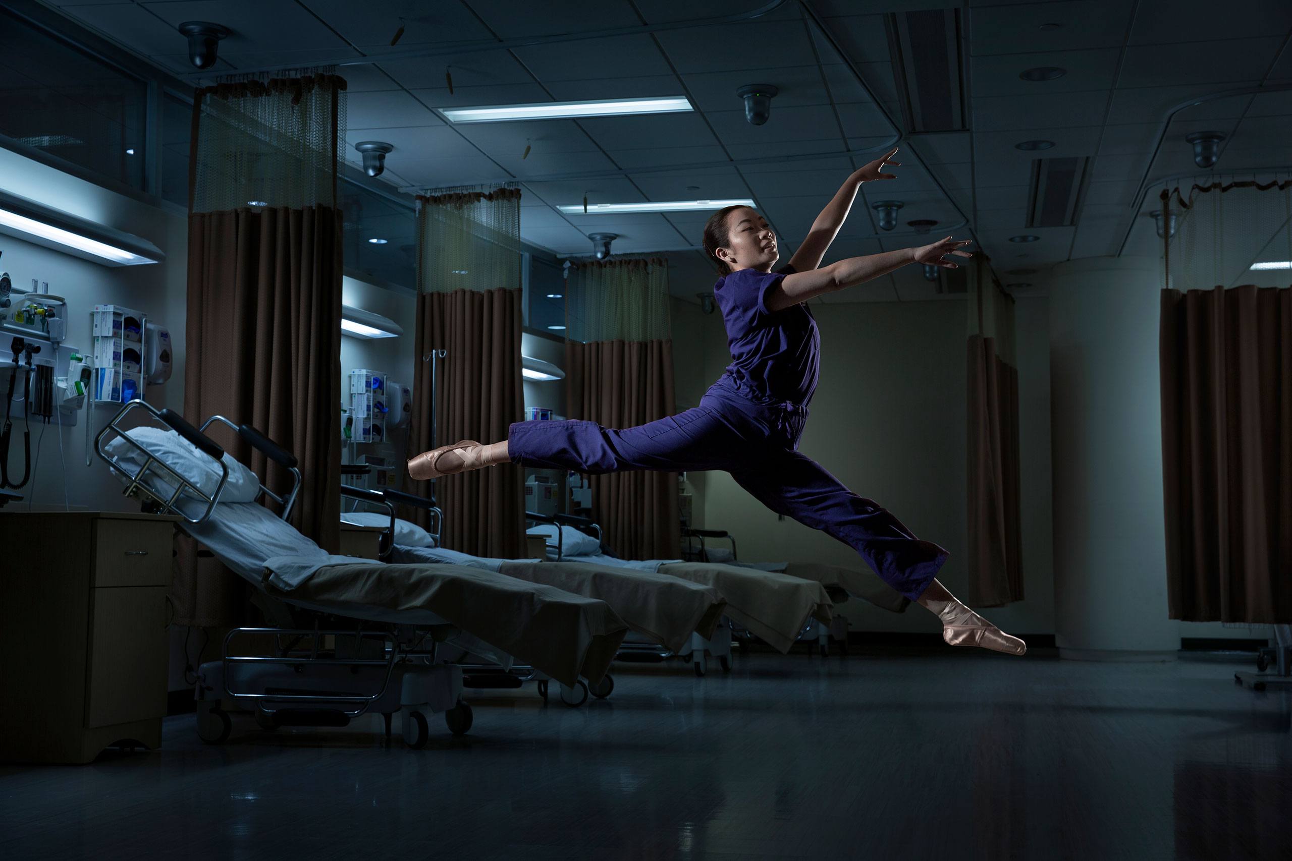 Rory Meyers nursing student Brittany Taam leaping in the air in a hospital room.