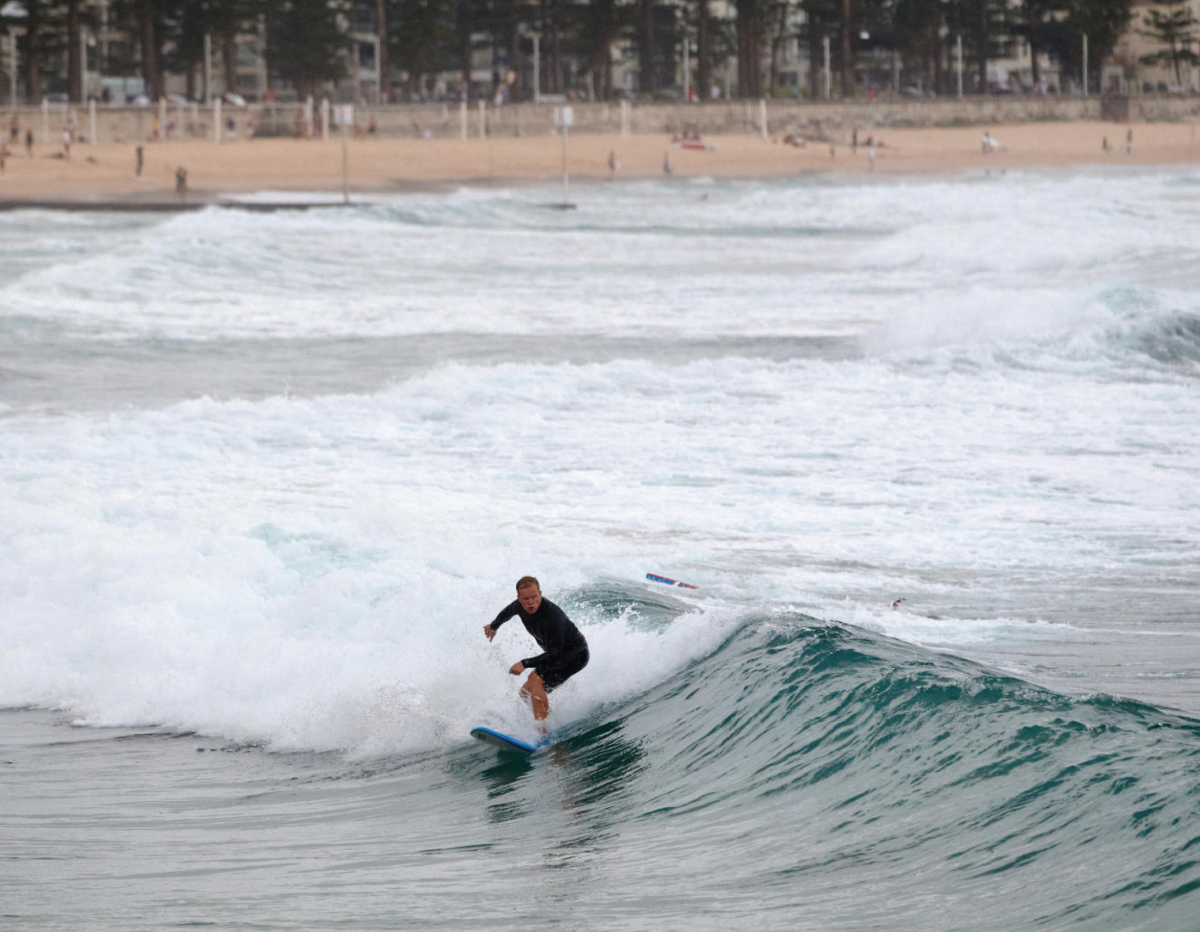 A person surfing in the ocean.