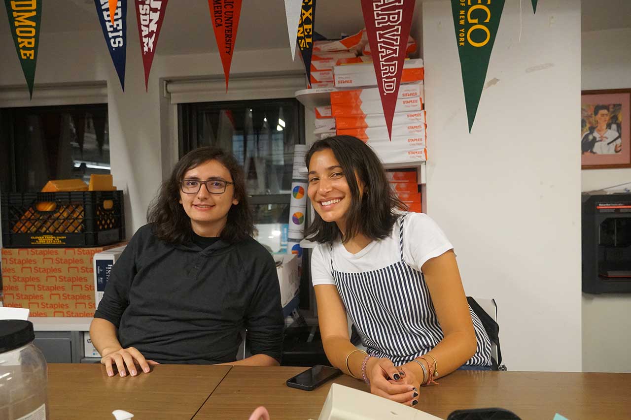 Blu Cervantes and Zoe Scretchings, who is treasurer of the Native American and Indigenous Student Group, together at a group meeting.