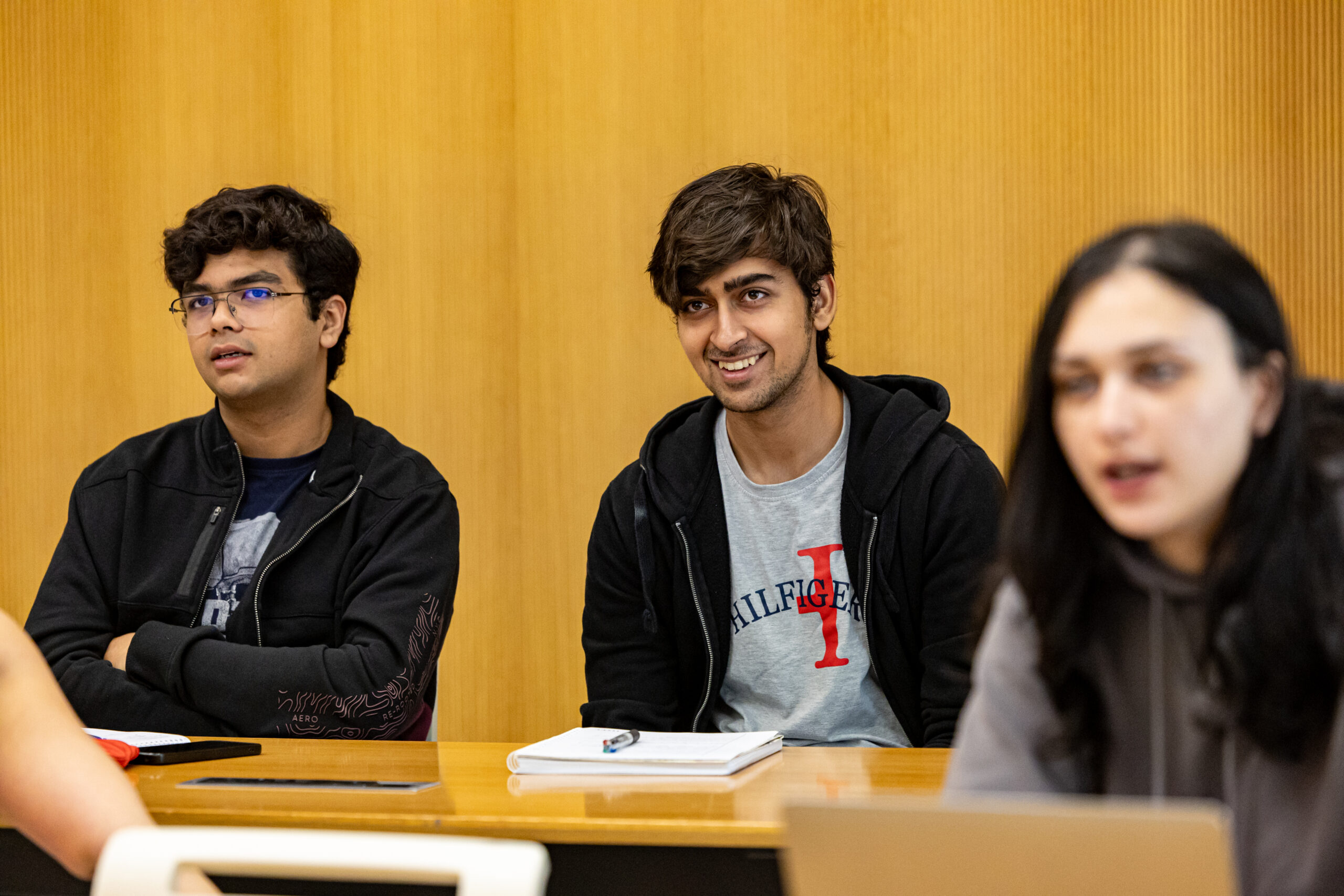 Students smiling in class.