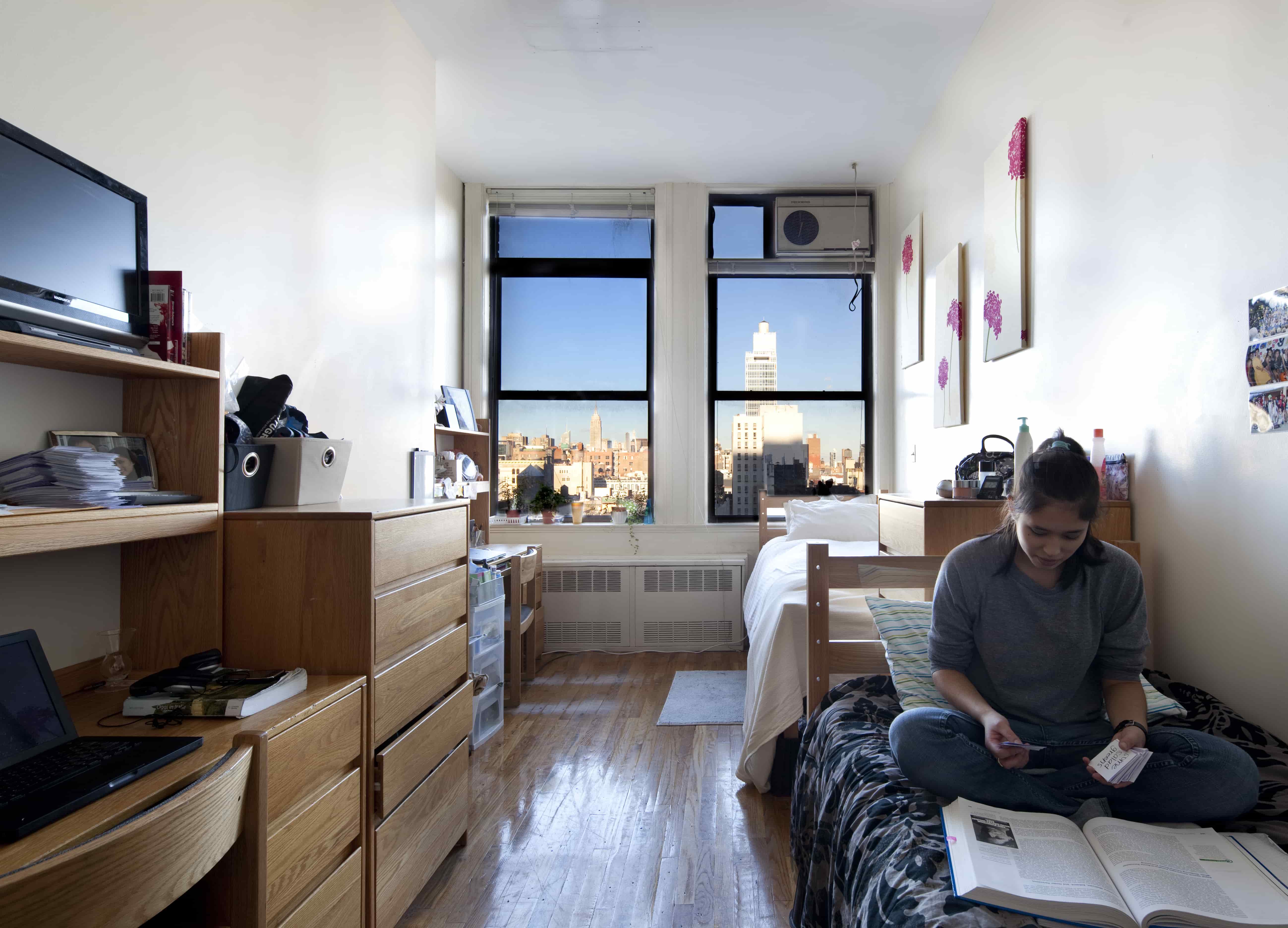A student in a residence hall room.