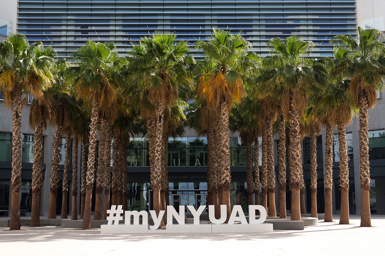 NYU Abu Dhabi campus sign that reads “#myNYUAD.”