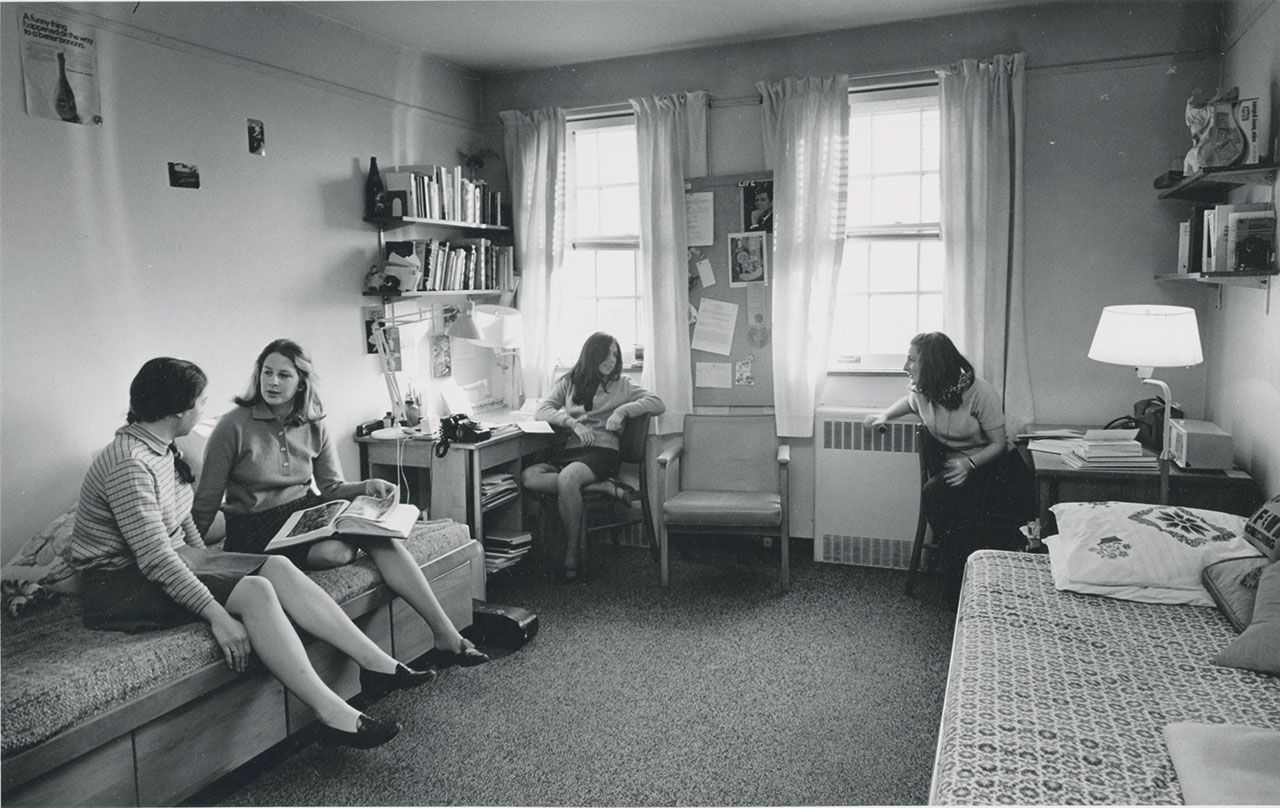 A throwback of a group of female students hanging out in an NYU residence hall.