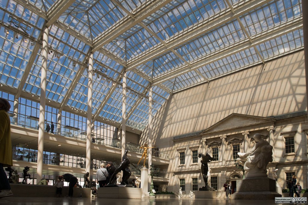 An open atrium illuminates a courtyard of statues