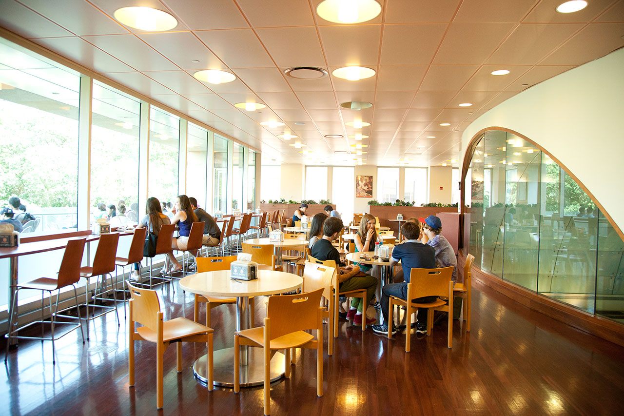 Students sitting in a dining area in the Kimmel Center.