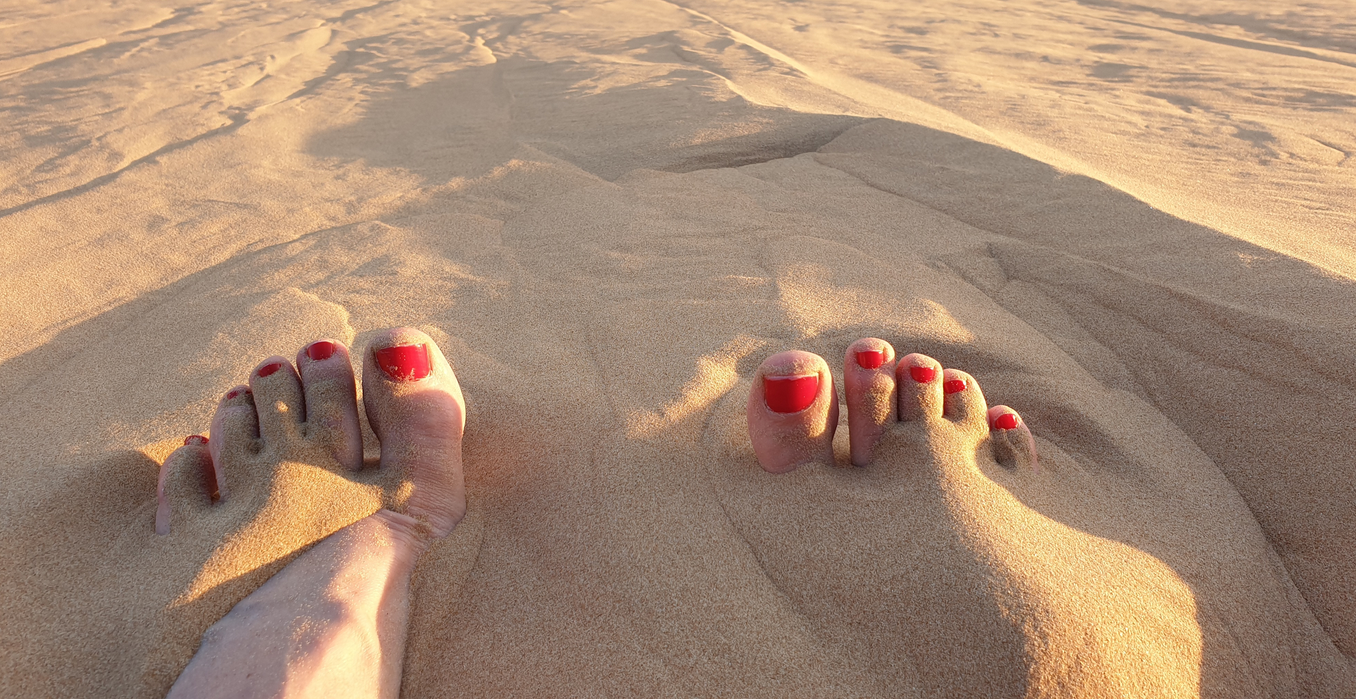 Feet in Abu Dhabi sand
