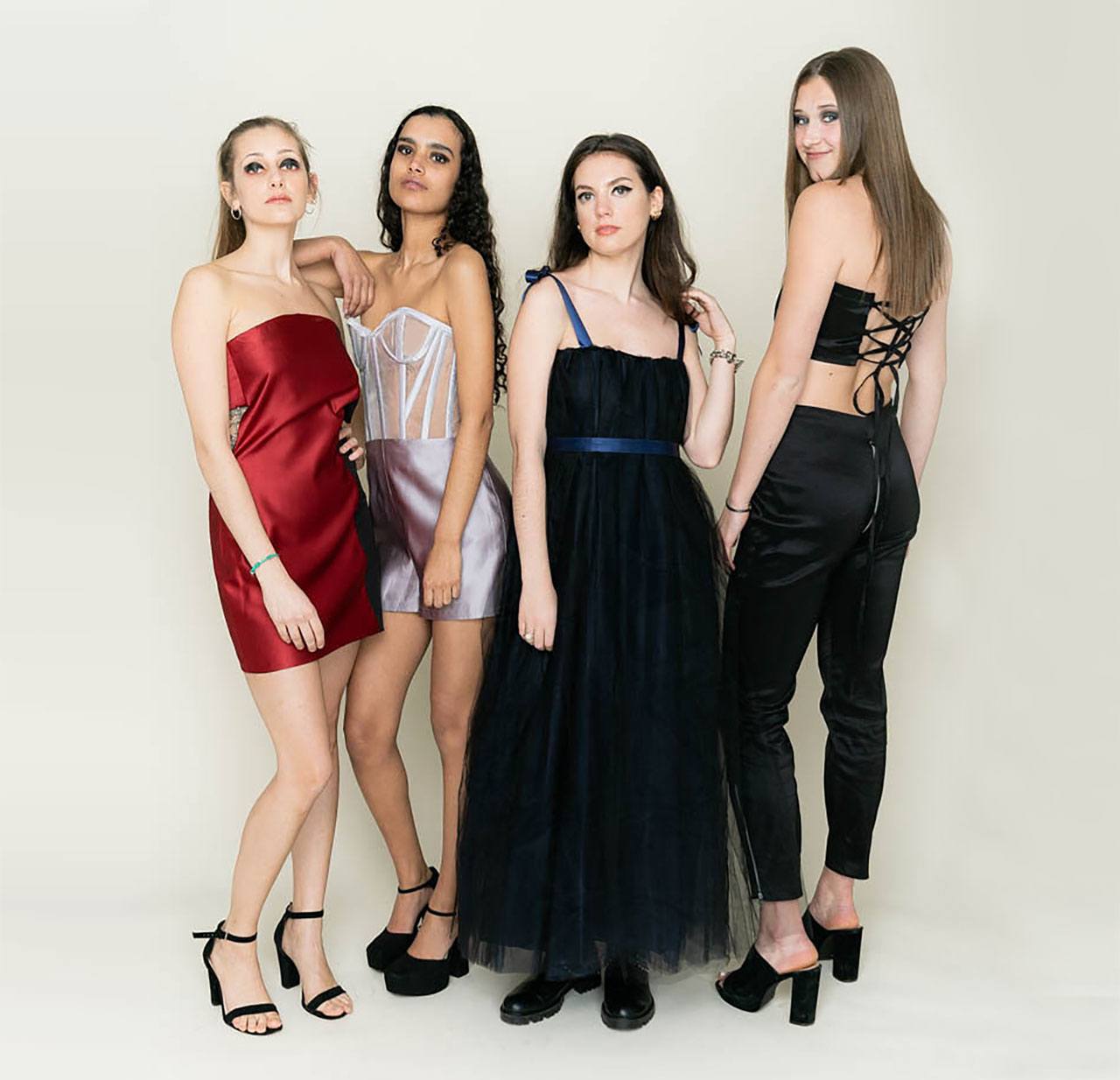 Madeline (right) and three models wearing her work.