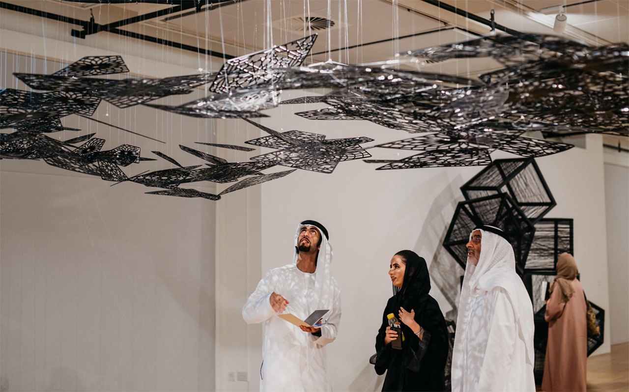 Visitors viewing artwork at the NYU Abu Dhabi Art Gallery.