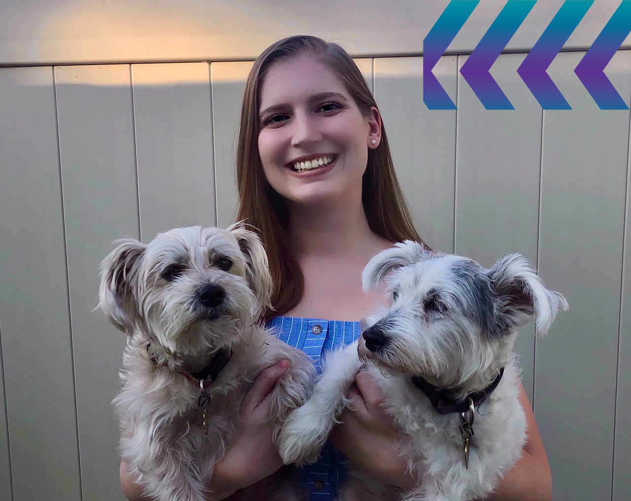 Rebecca Brett holding her dogs.