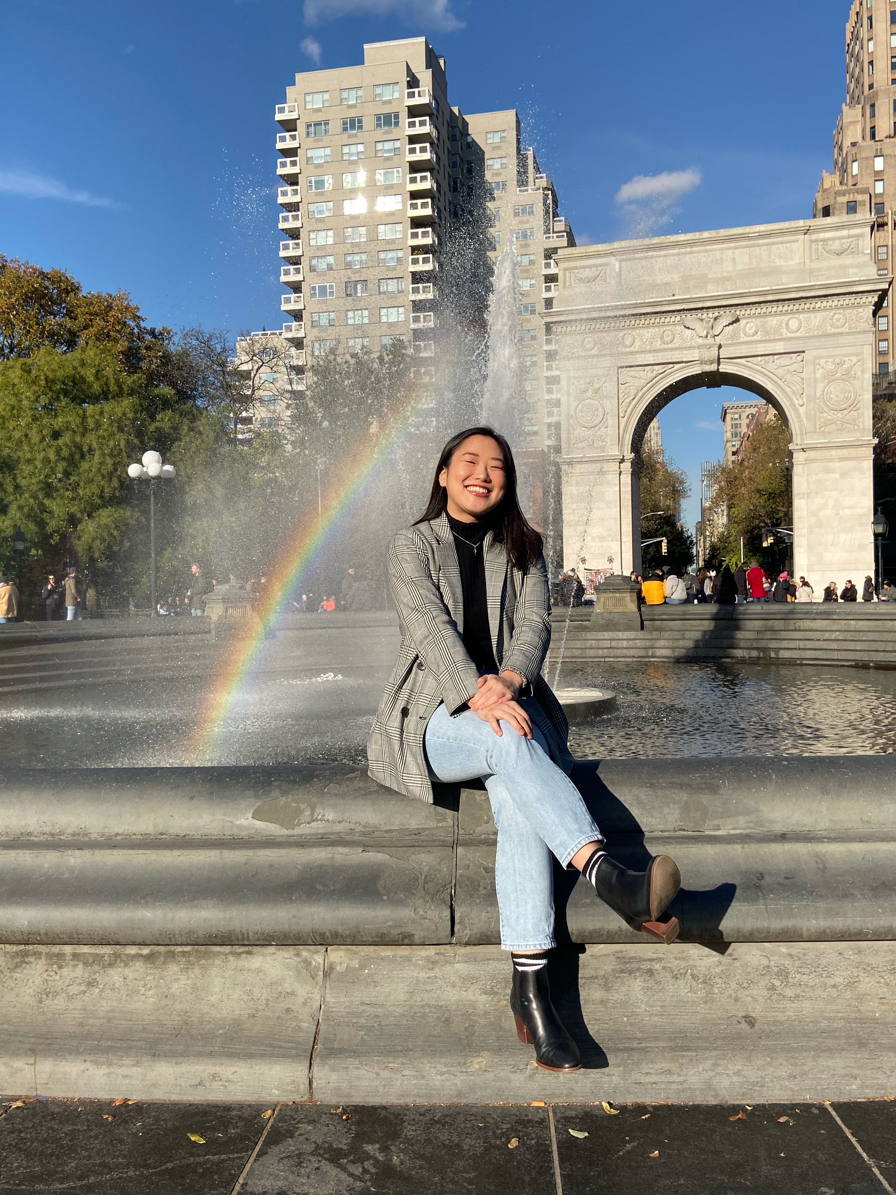 A student sitting in Washington Square Park.