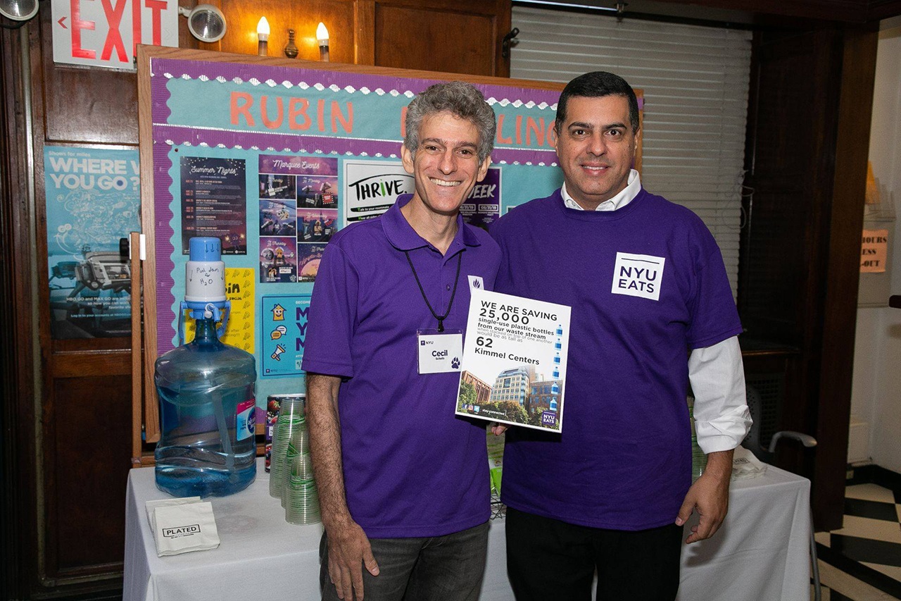 Cecil Scheib (left) and another university community member at NYU’s plastic bottle–free Welcome Day.
