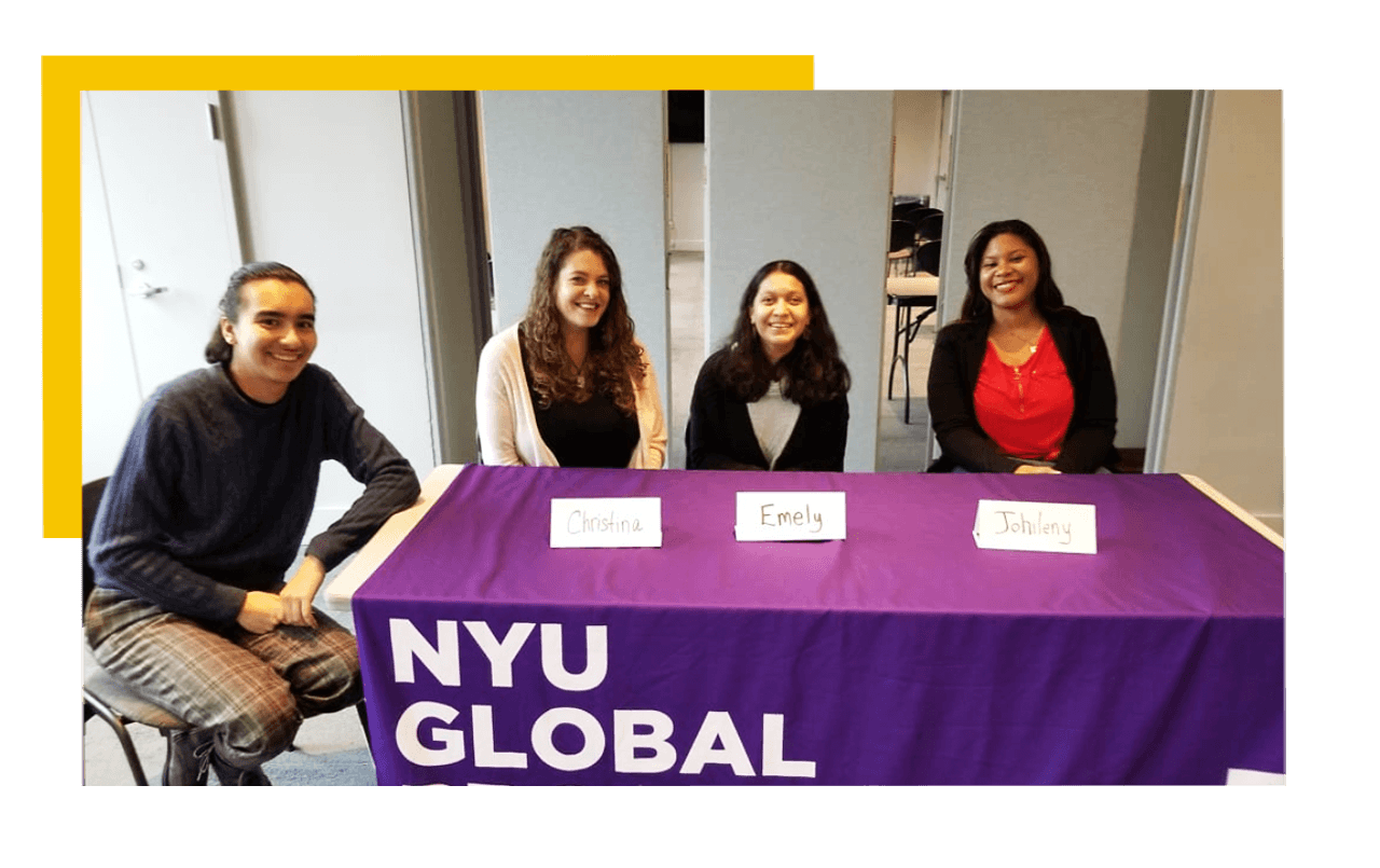 DSU students with a booth set up at an NYU event.
