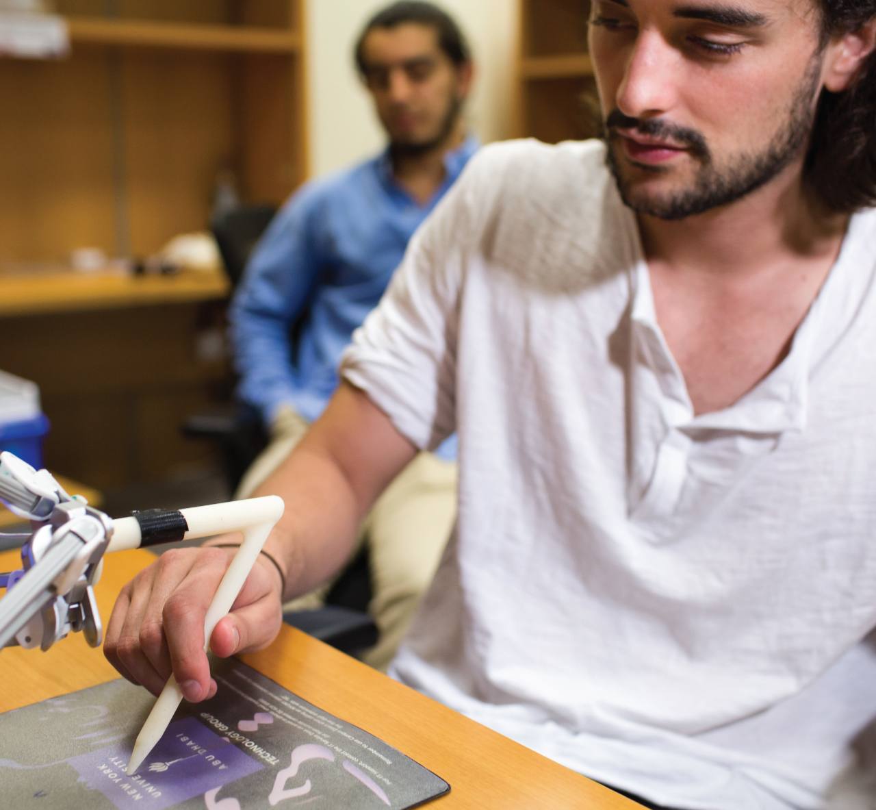 A student working with a robotic prototype.
