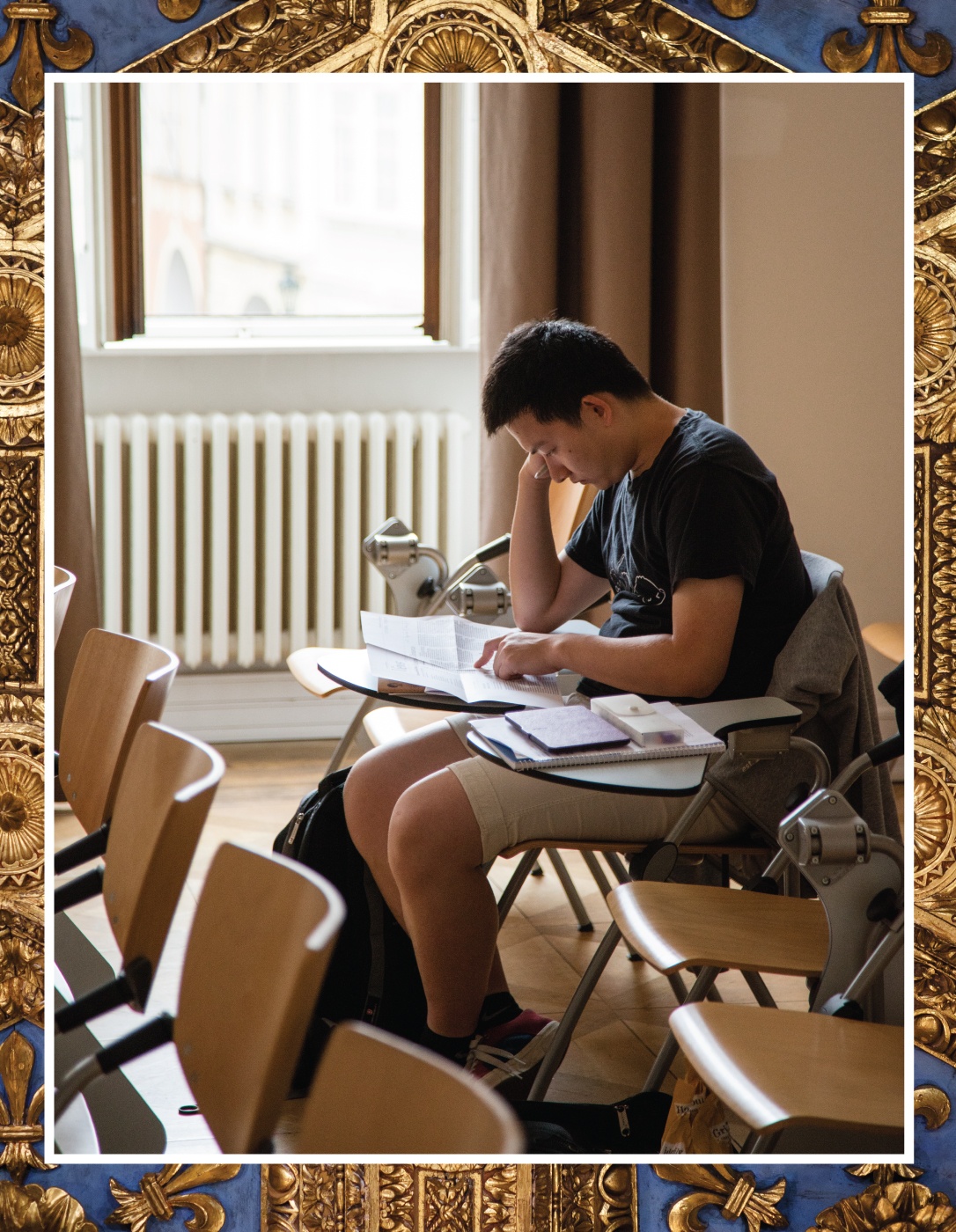 A student studying at a desk.