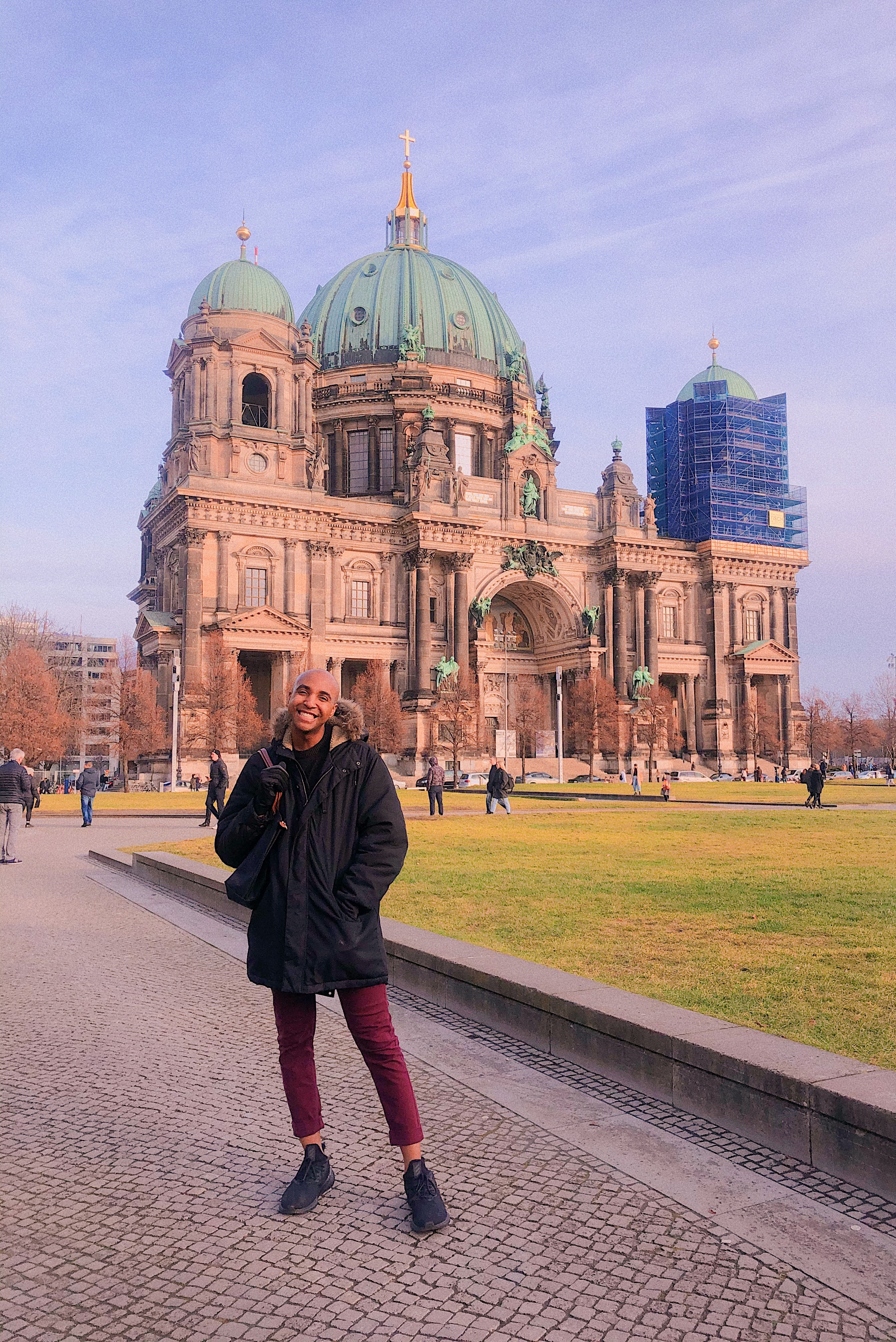 NYU Admissions Ambassador posing outside a German cathedral.