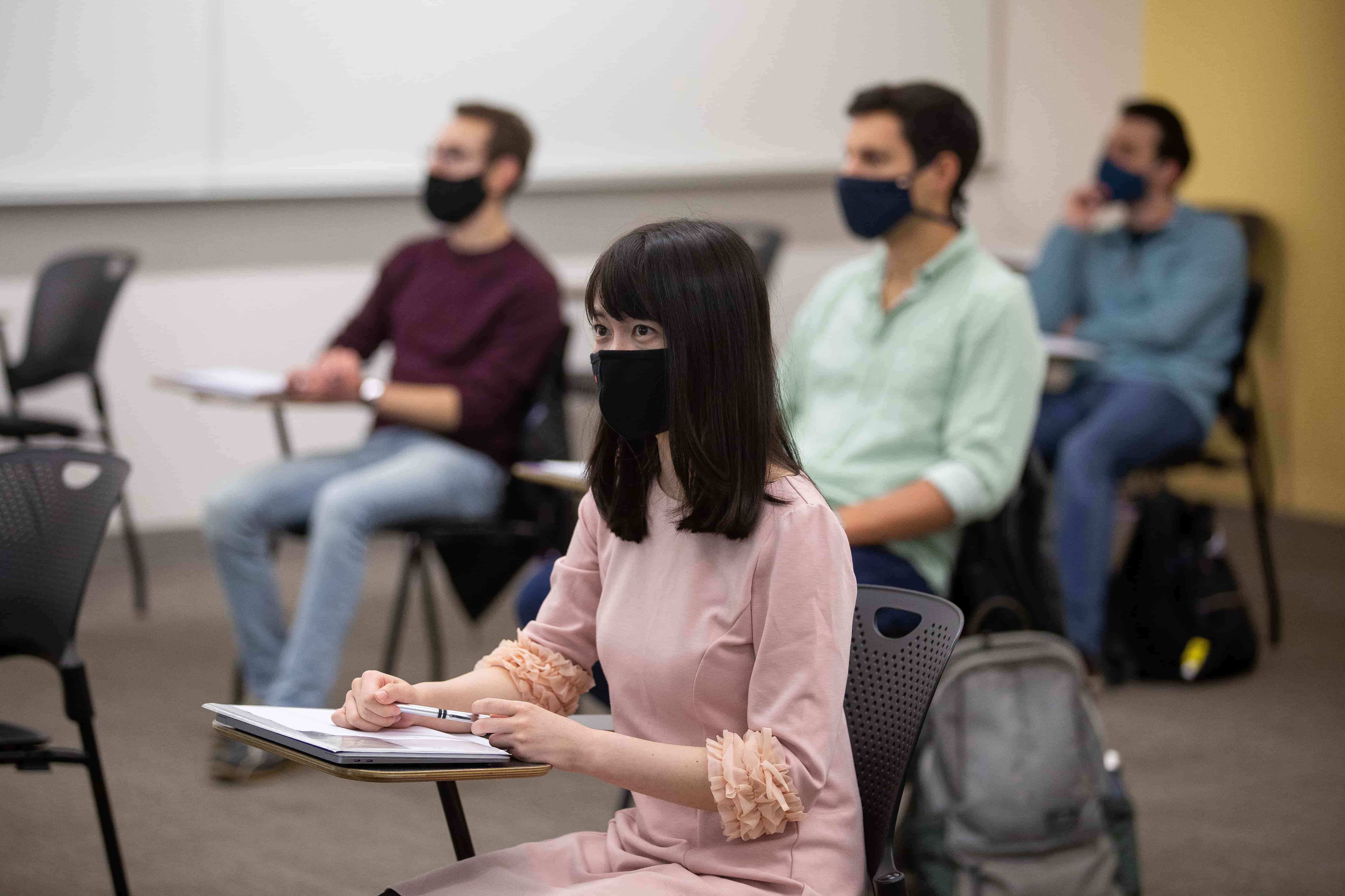 Students in a classroom wearing masks.