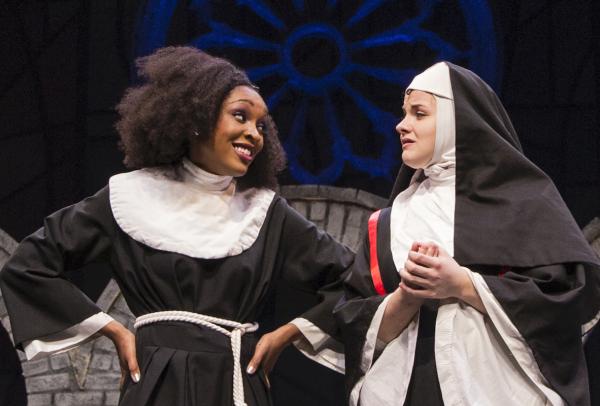 Two students dressed as nuns on stage