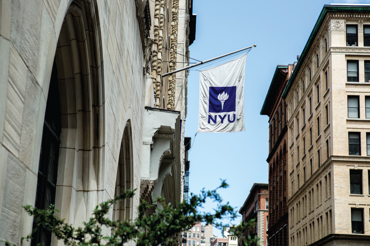 NYU flag hanging from campus building