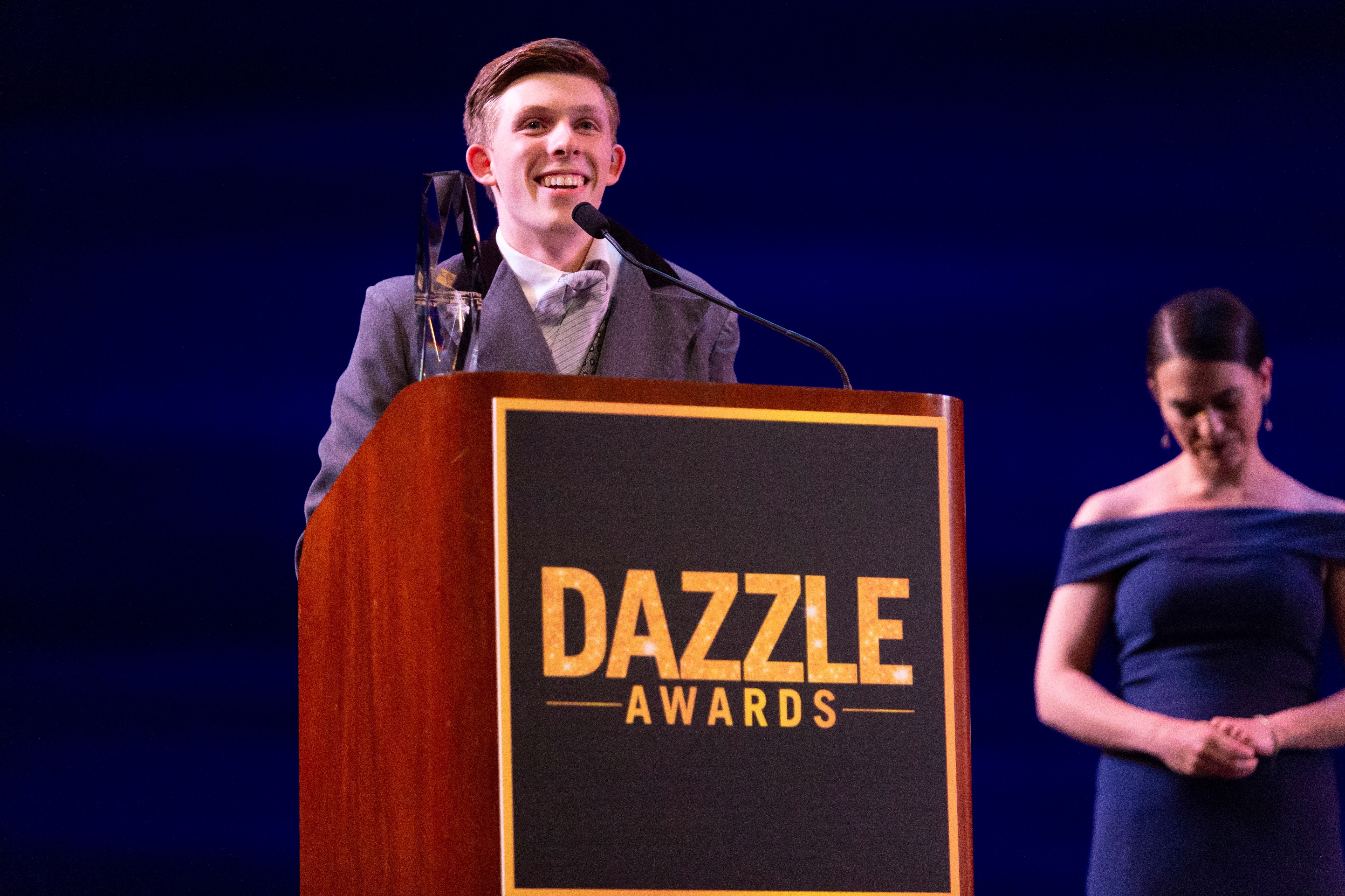 J.R. Heckman accepting an award at the Dazzle Awards ceremony