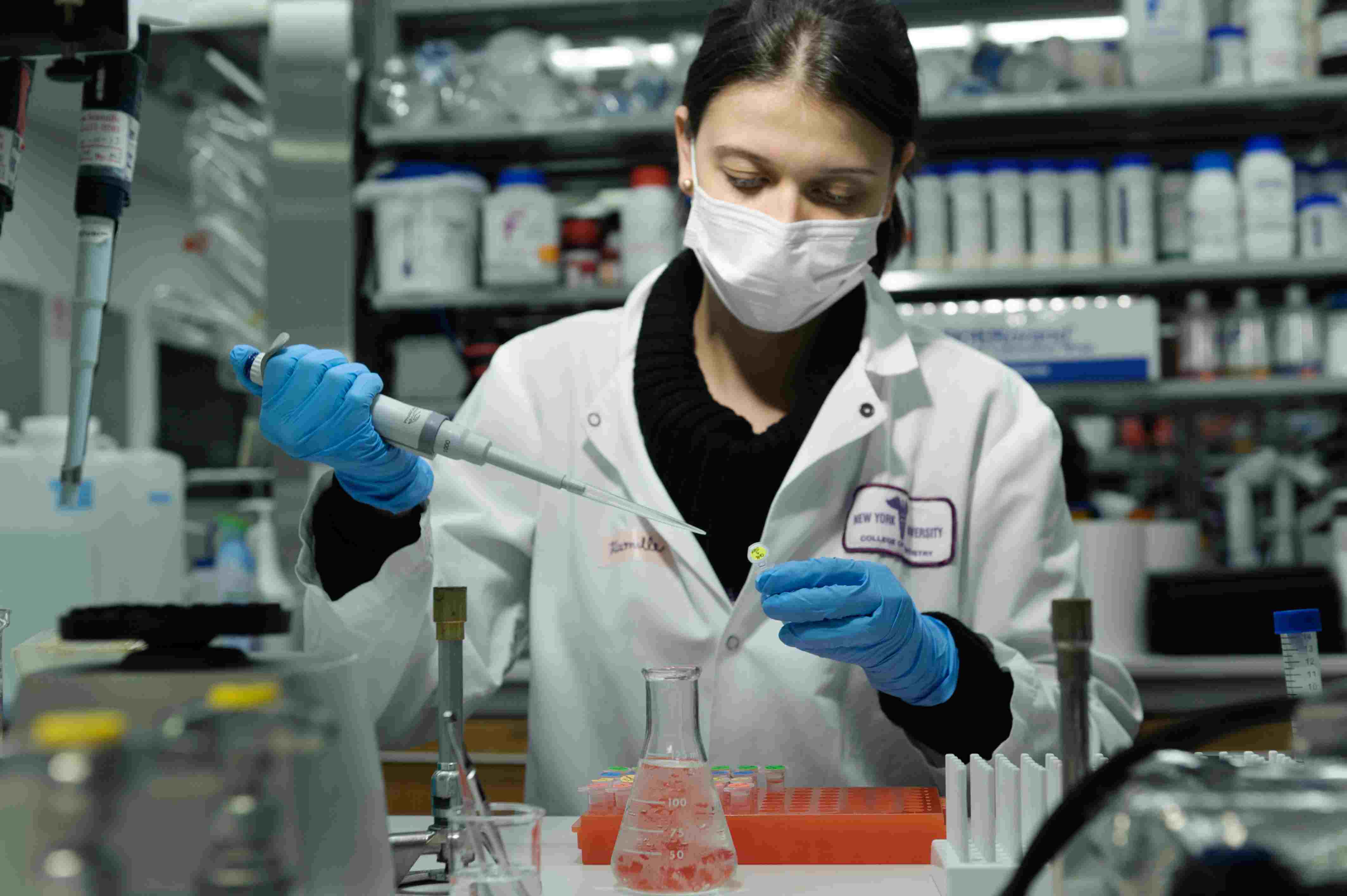 An NYU student conducting researchin a lab.