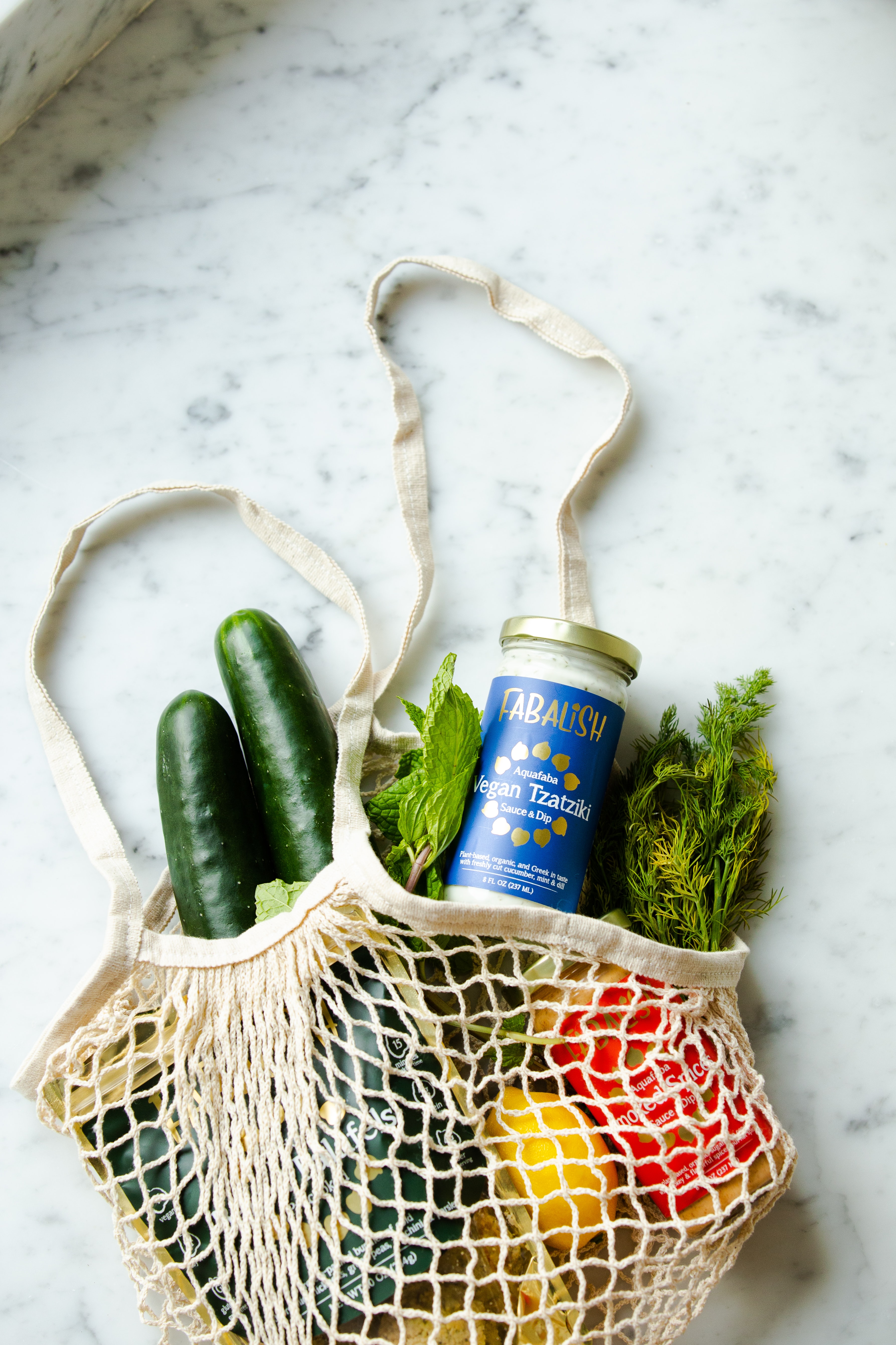 Produce in a sustainable, reusable shopping bag.