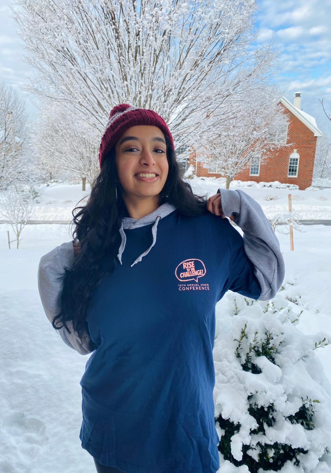 USWIB committee member posing in merch