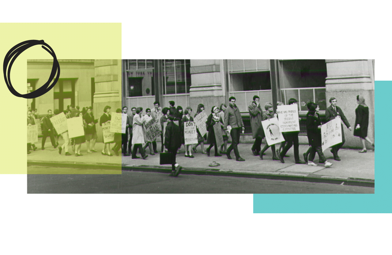 A vintage photo of a group of protestors walking down a street with signs.