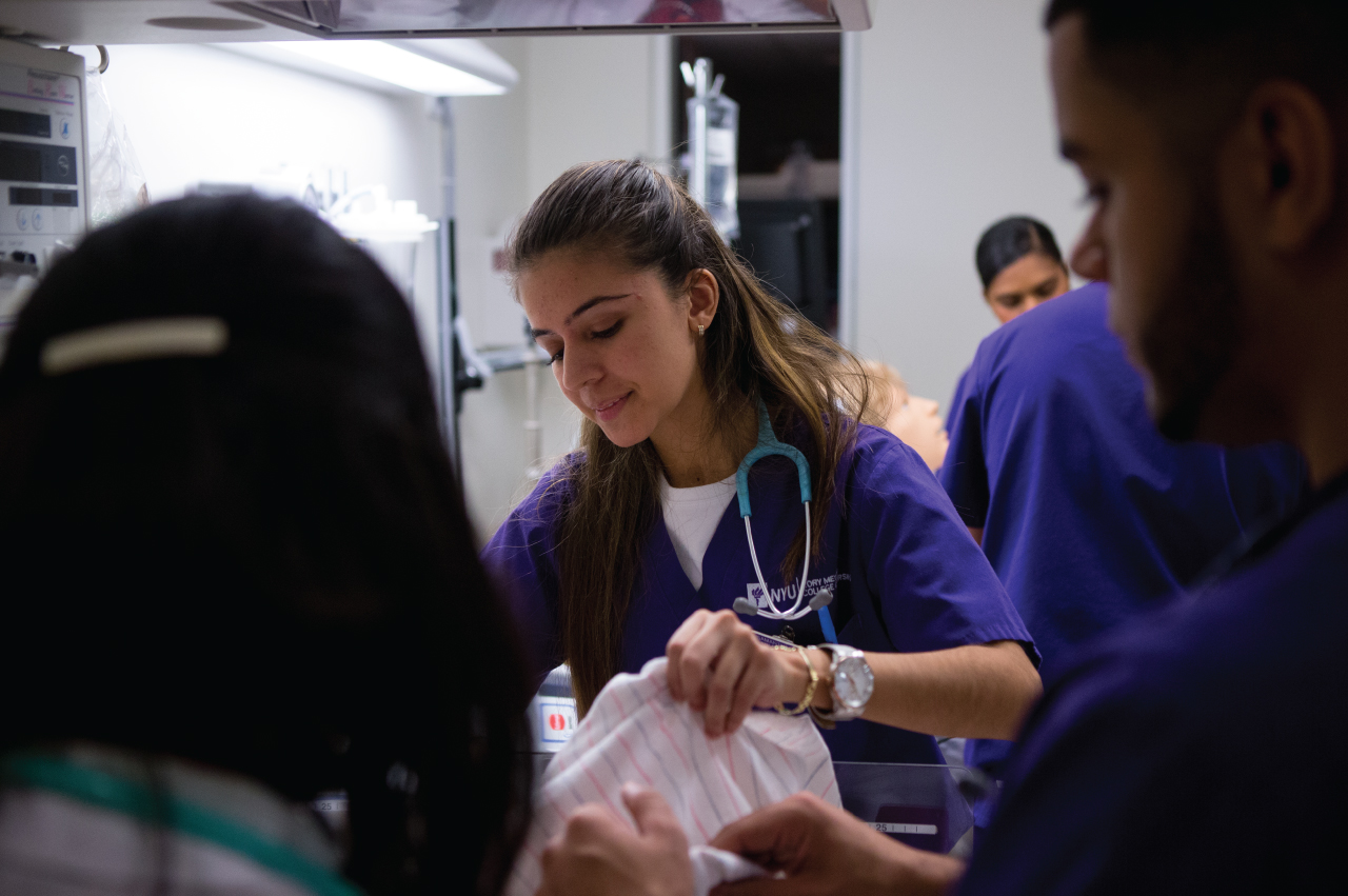 A Nursing major working in the Clinical Simulation Learning Center.