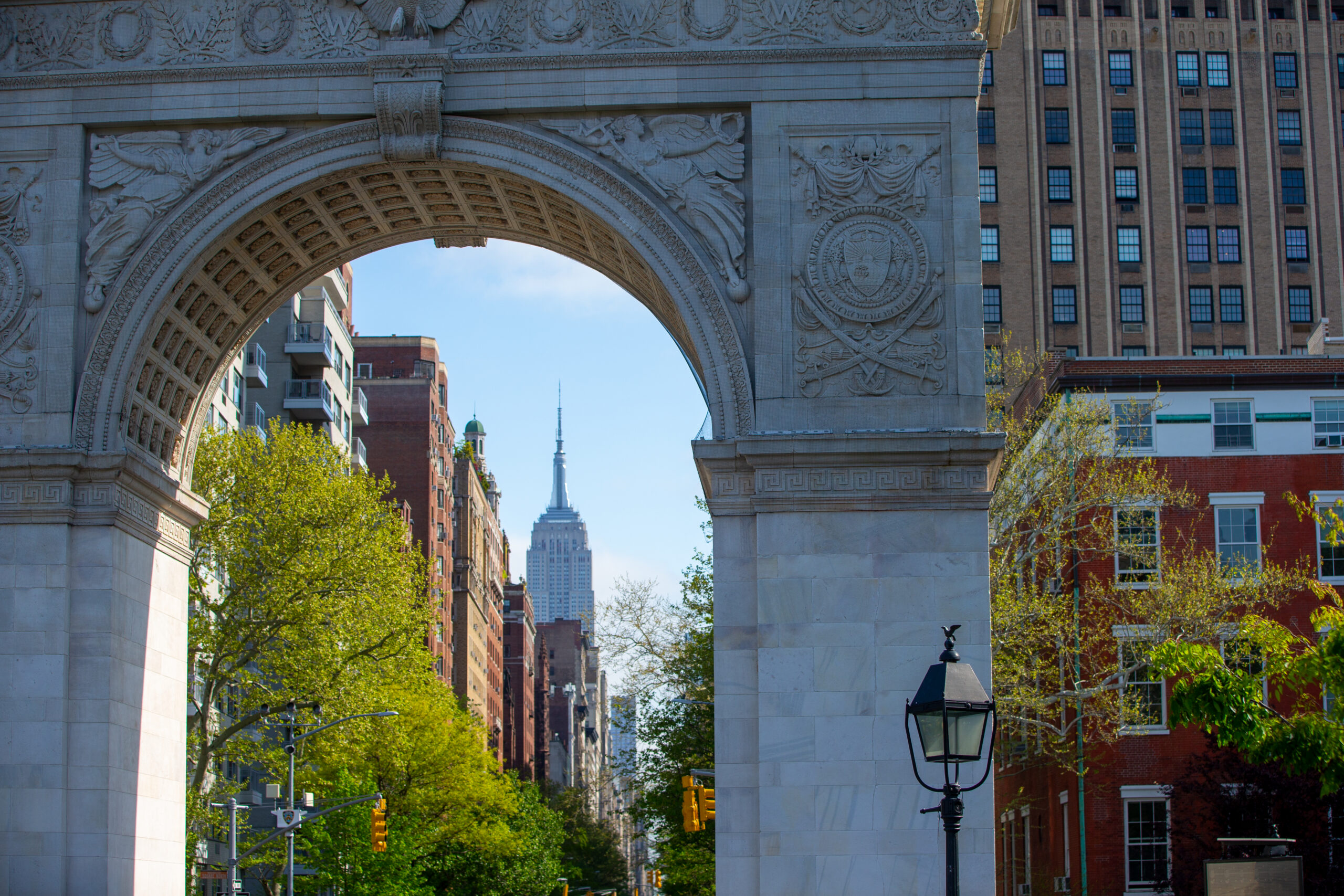 A close-up of the Washington Square Arch on a clear day.