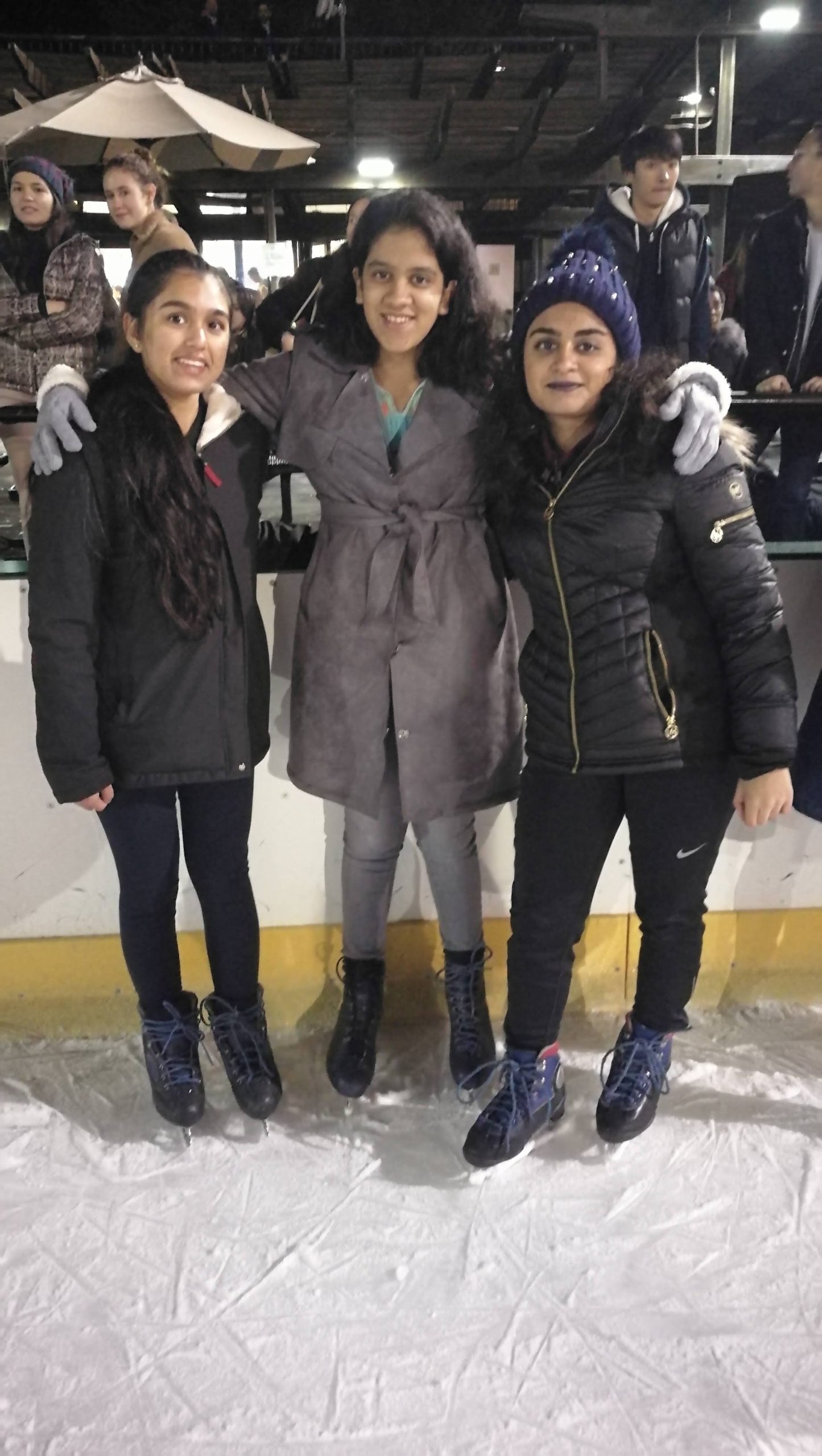 3 Girls on an Ice Rink in Ice Skates