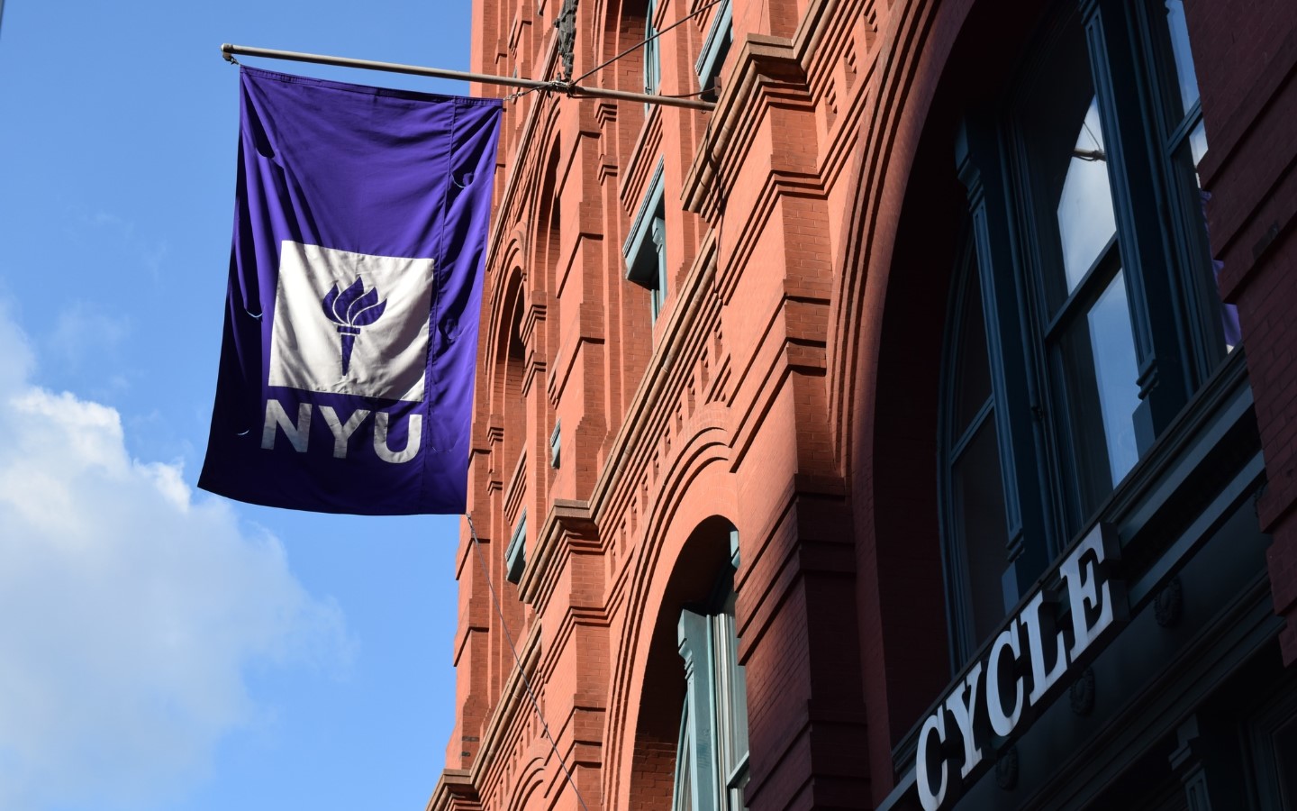 NYUʼs iconic violet flag.