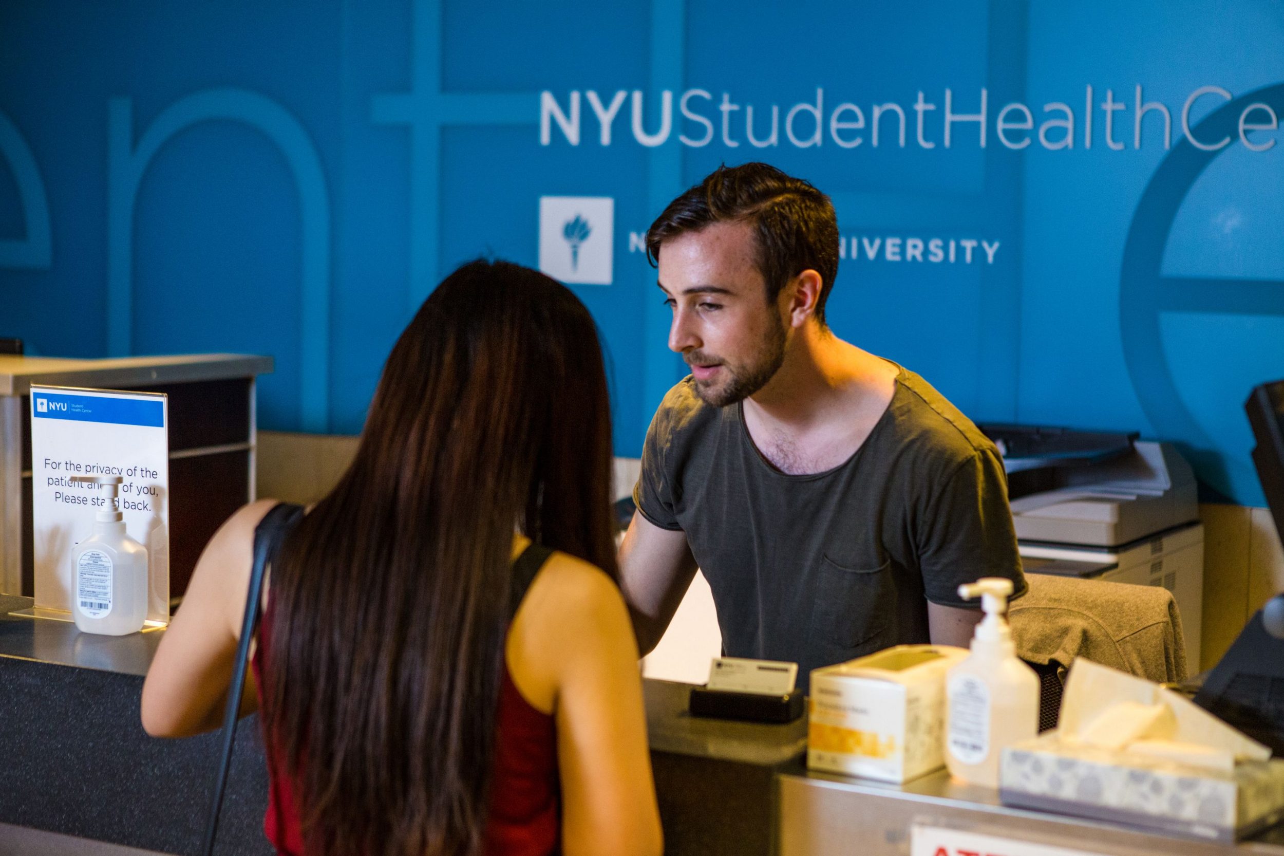 A student checking into the Student Health Center.