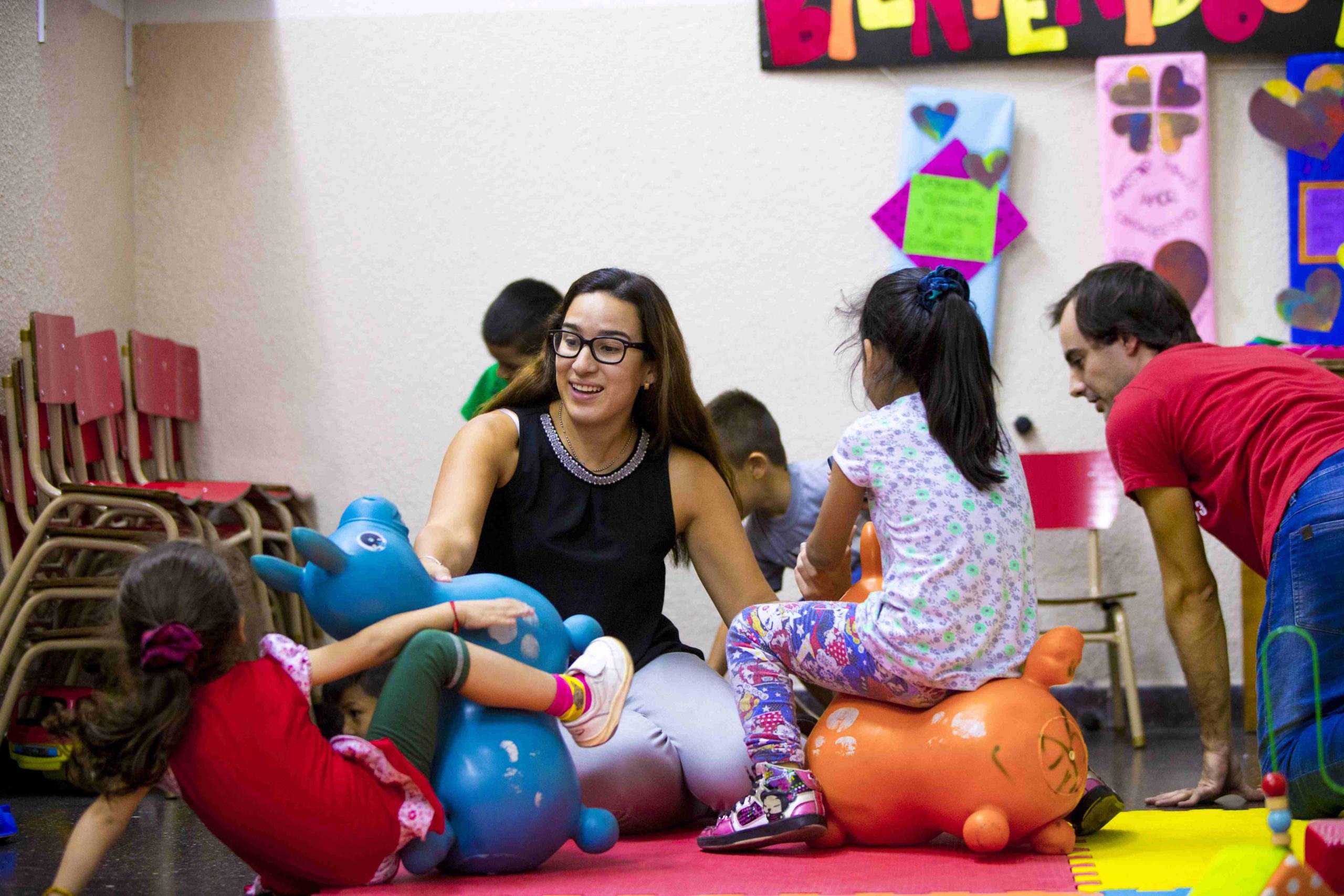 student playing with children