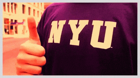 An NYU student giving a thumbs-up.