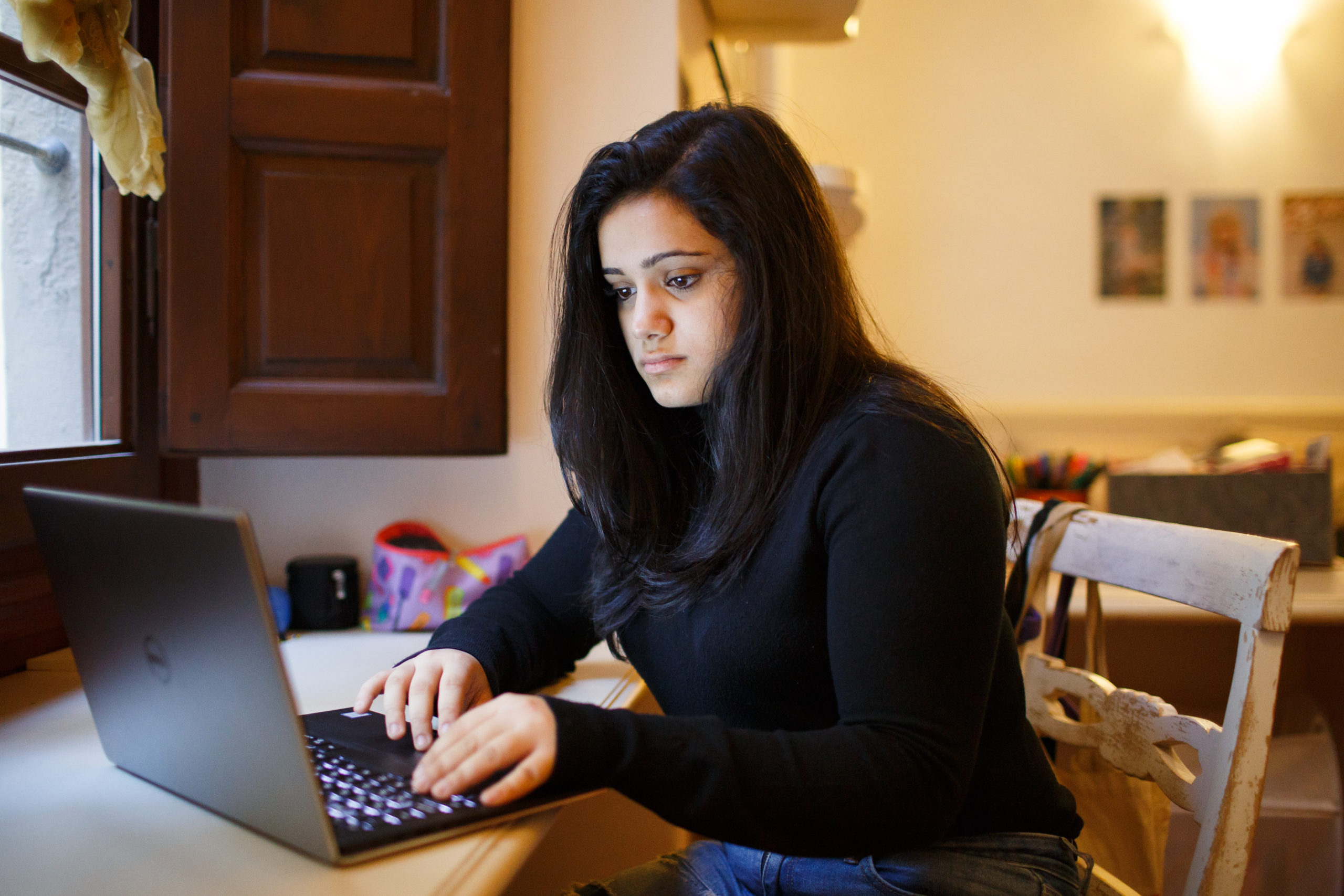 A student on a laptop.