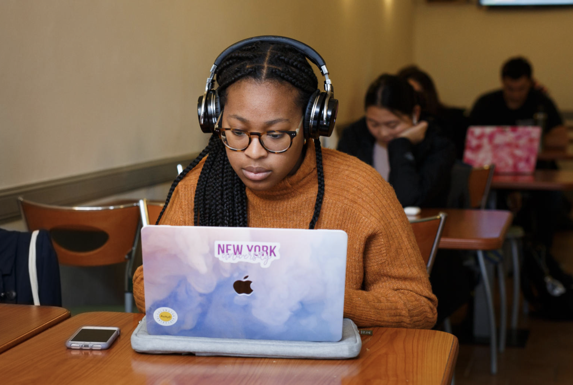 A student on their laptop in a designated work space.