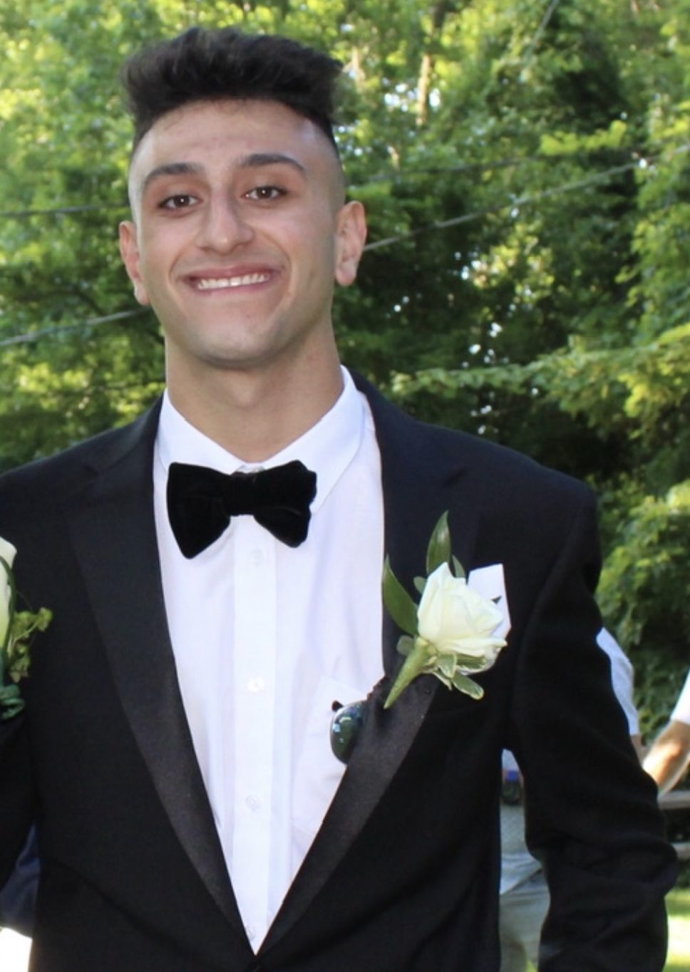 Aaron Souferi, NYU First Class participant, smiling in a tuxedo.