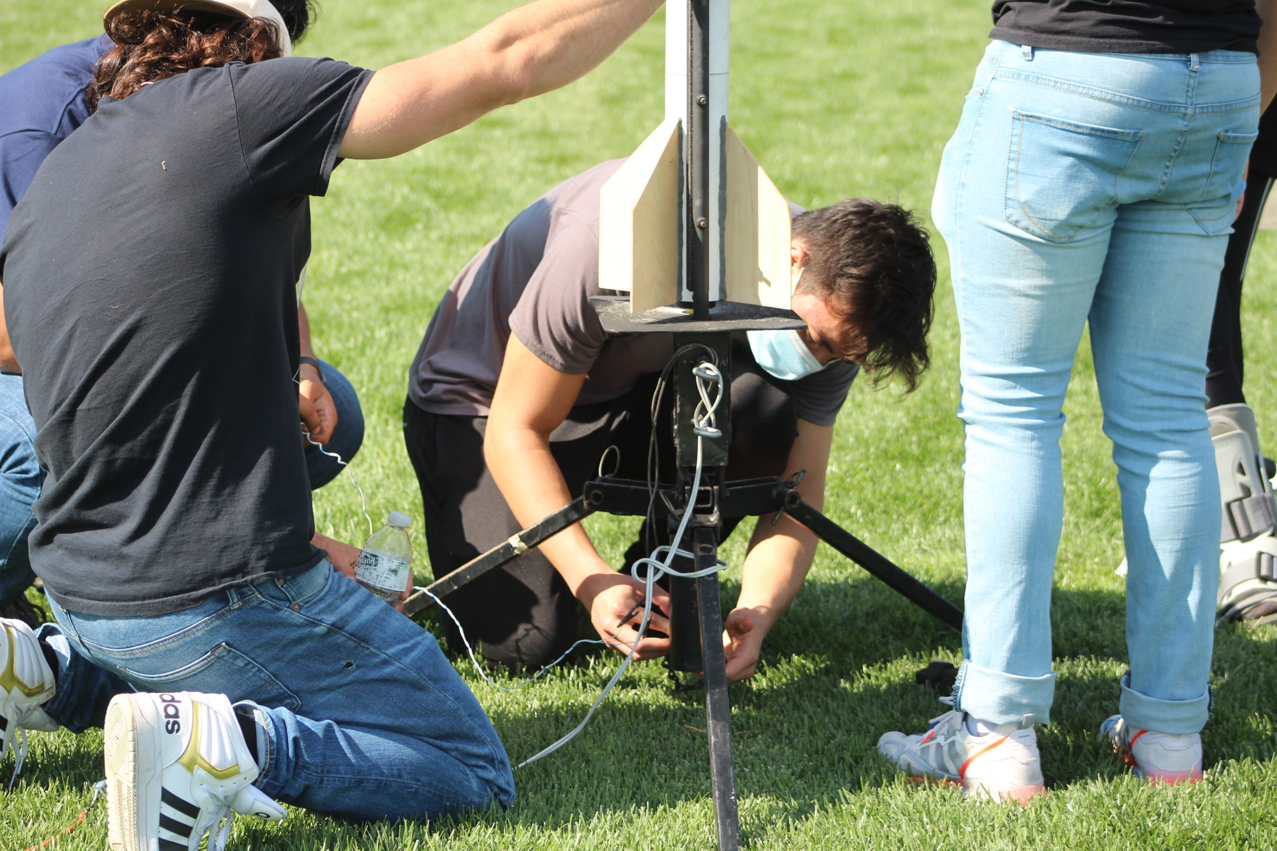 Students setting up a rocket for launch