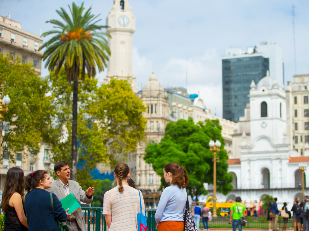 A group tour standing in a street of Buenos Aires.