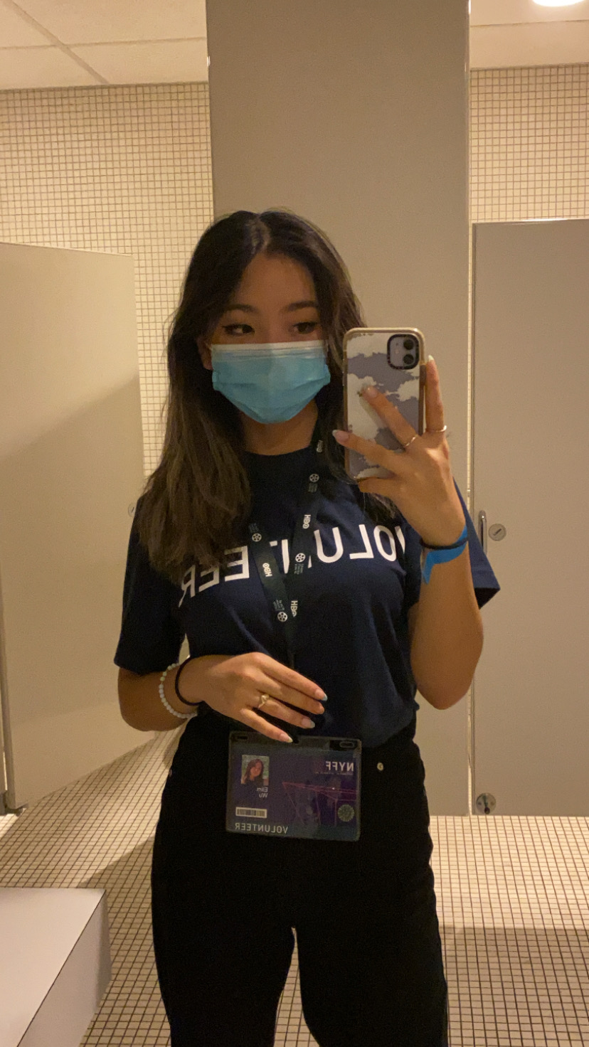 Elim Wu, the author, taking a mirror selfie and wearing a mask.