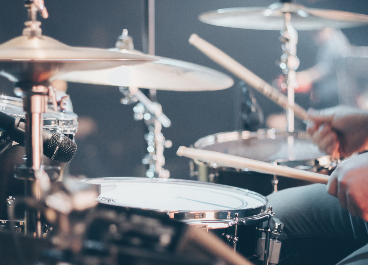 Close-up of a musician playing the drums.